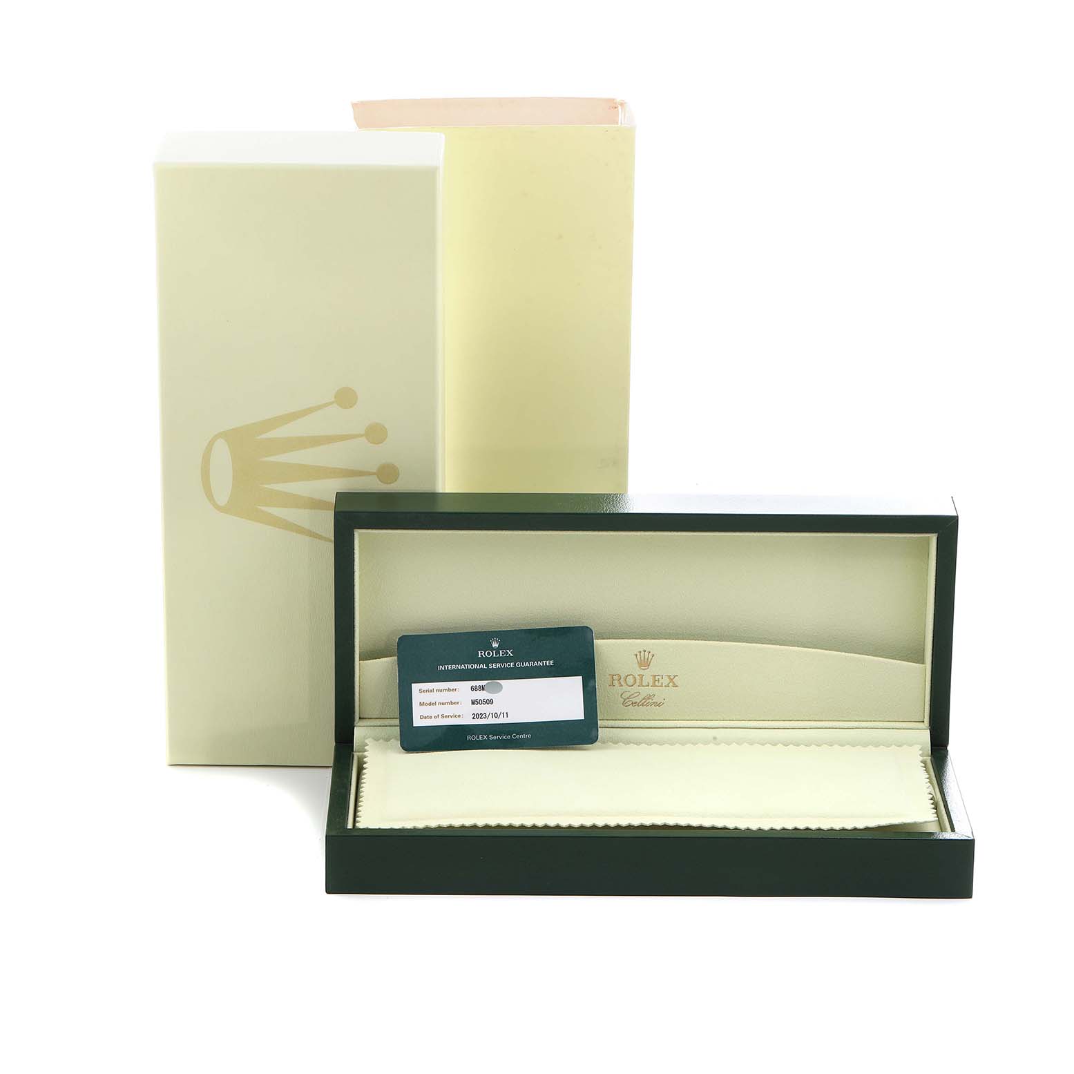 The image shows the Rolex Cellini M50509 Men's White Gold Black Dial watch box, protective outer box, and guarantee card placed inside the open display case.