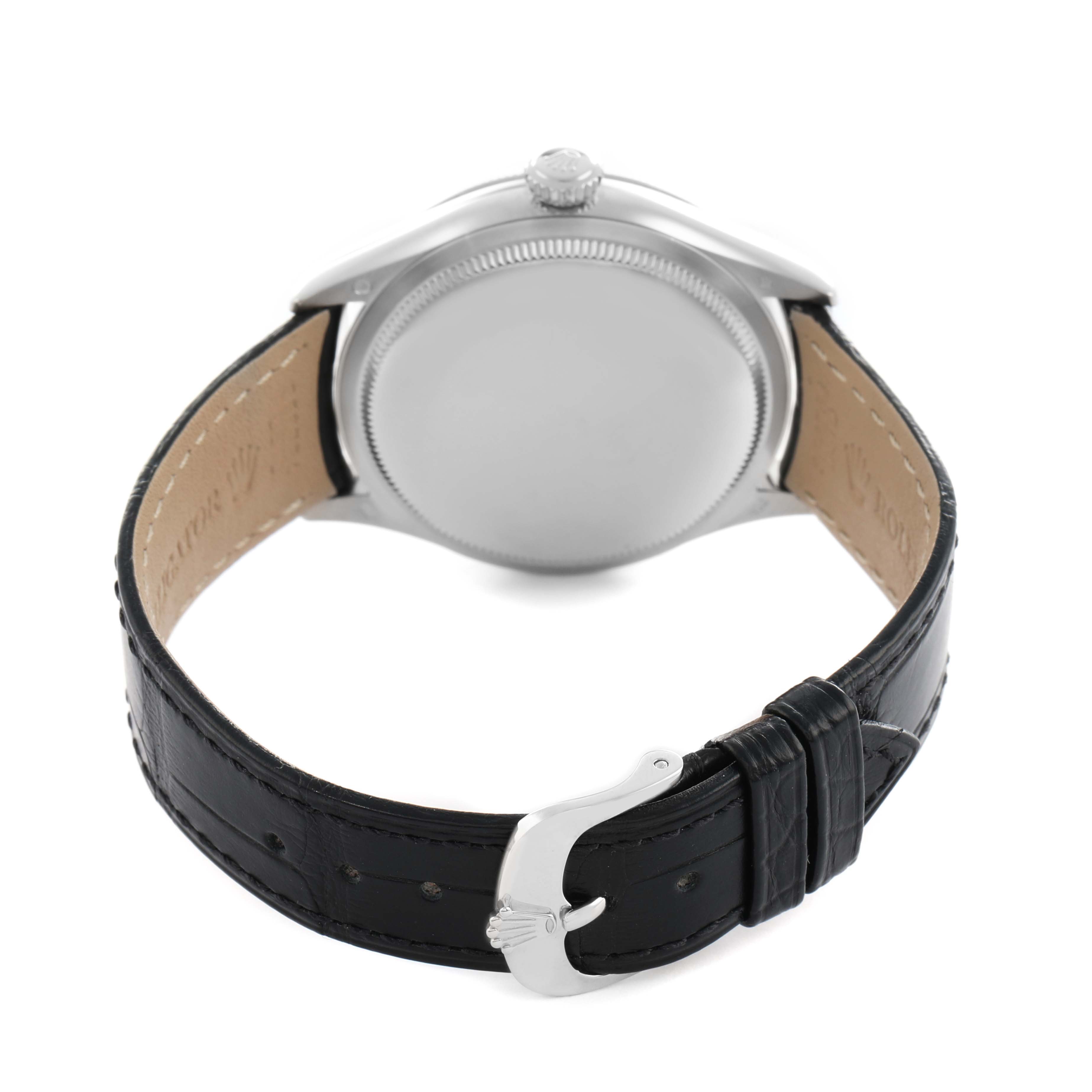 The Rolex Cellini M50509 Men's White Gold Black Dial watch is shown from the back, highlighting the case back, strap, and clasp.