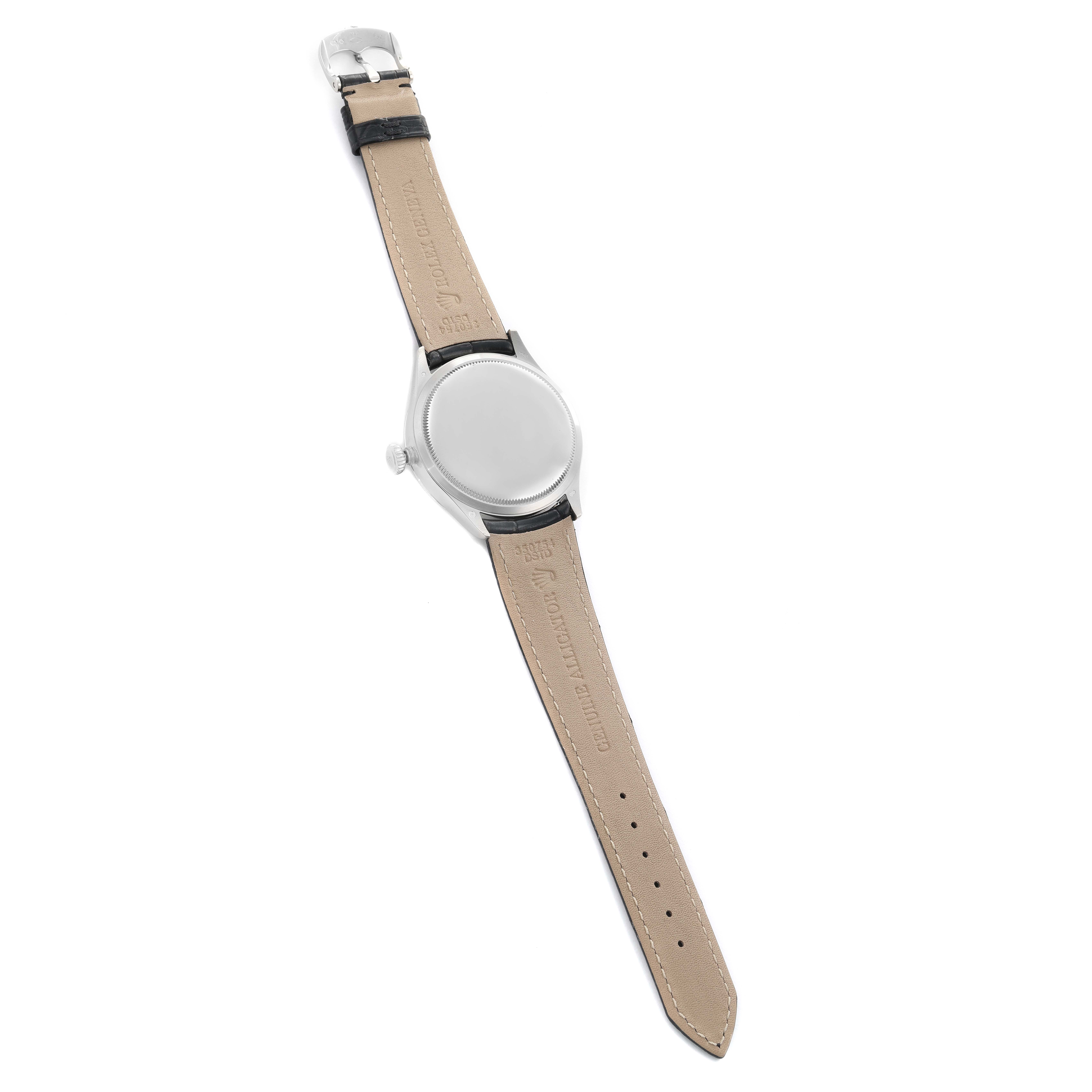 The Rolex Cellini M50509 Men's White Gold Black Dial watch is shown from the back, displaying the case back and leather strap with buckle.