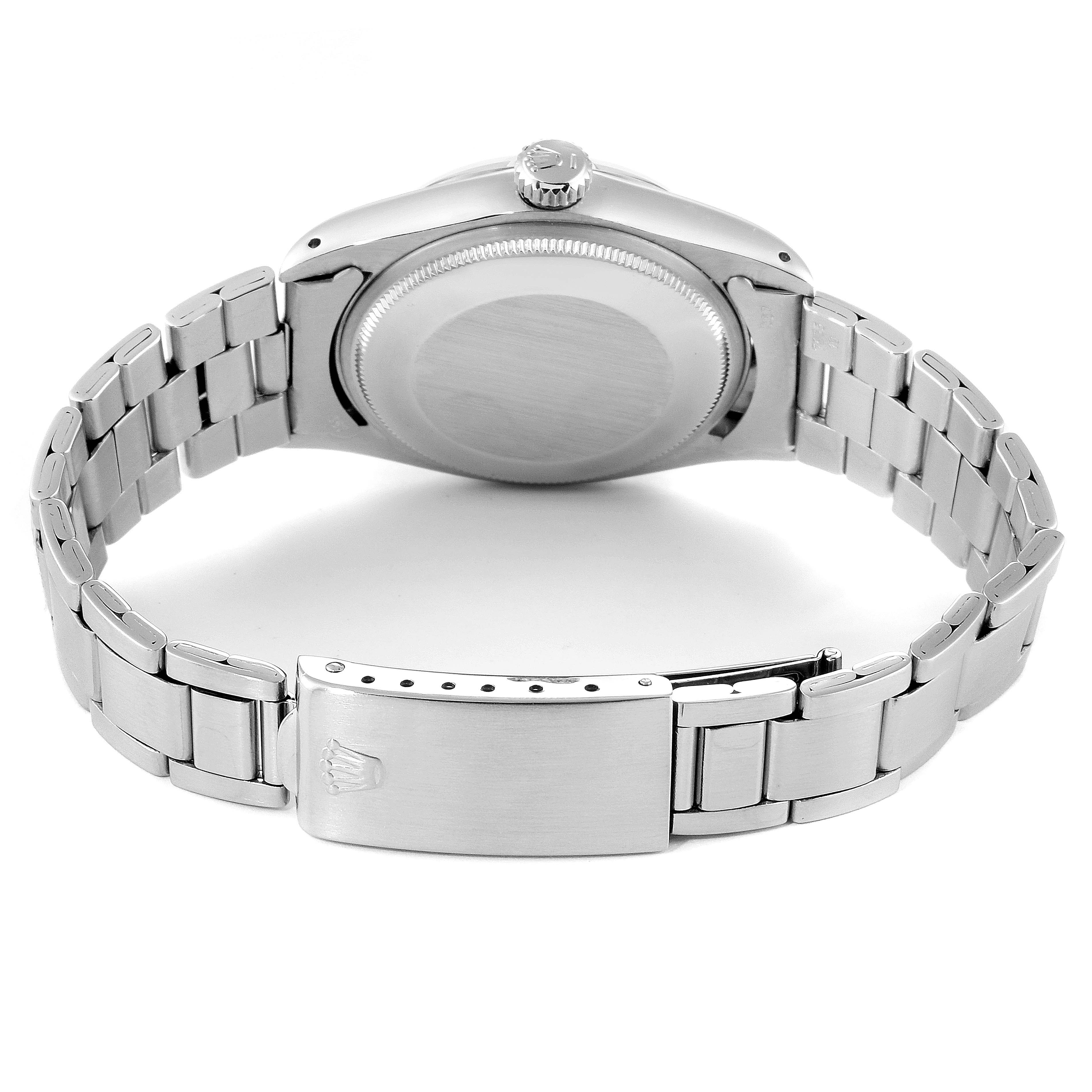 The image shows the back view of a Rolex Vintage Collection 1500 Men's Stainless Steel Silver Dial 1500 Men's Stainless Steel Silver Dial watch, highlighting the stainless steel case and bracelet.