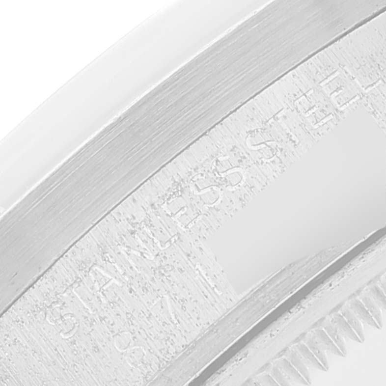 The close-up image shows the engraved text on the stainless steel case back of the Vintage Collection model by Rolex.