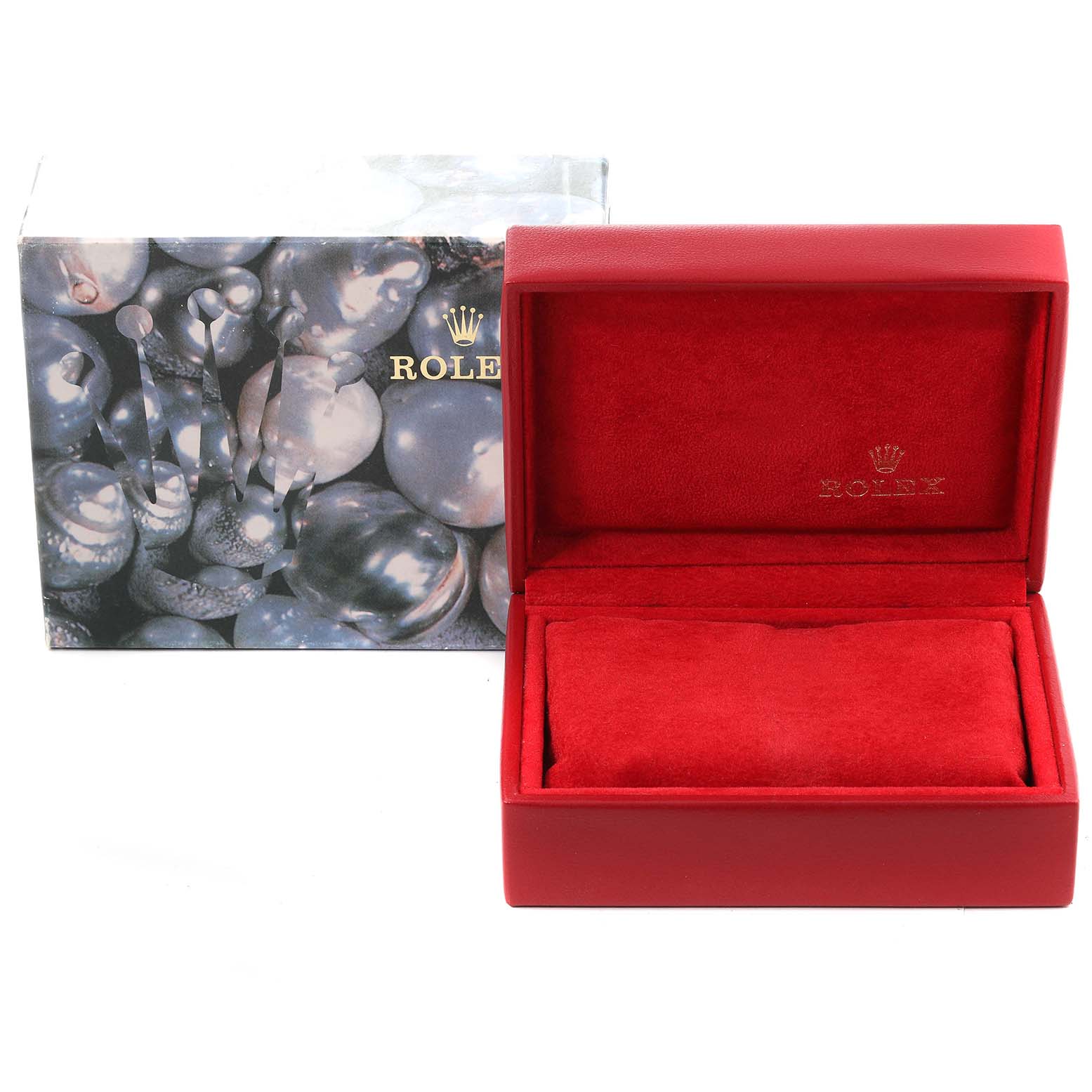 This image shows an open red Rolex Datejust 79174 Women's Stainless Steel Black Dial 79174 Women's Stainless Steel Black Dial watch box with a matching cushion, placed in front of its outer packaging.