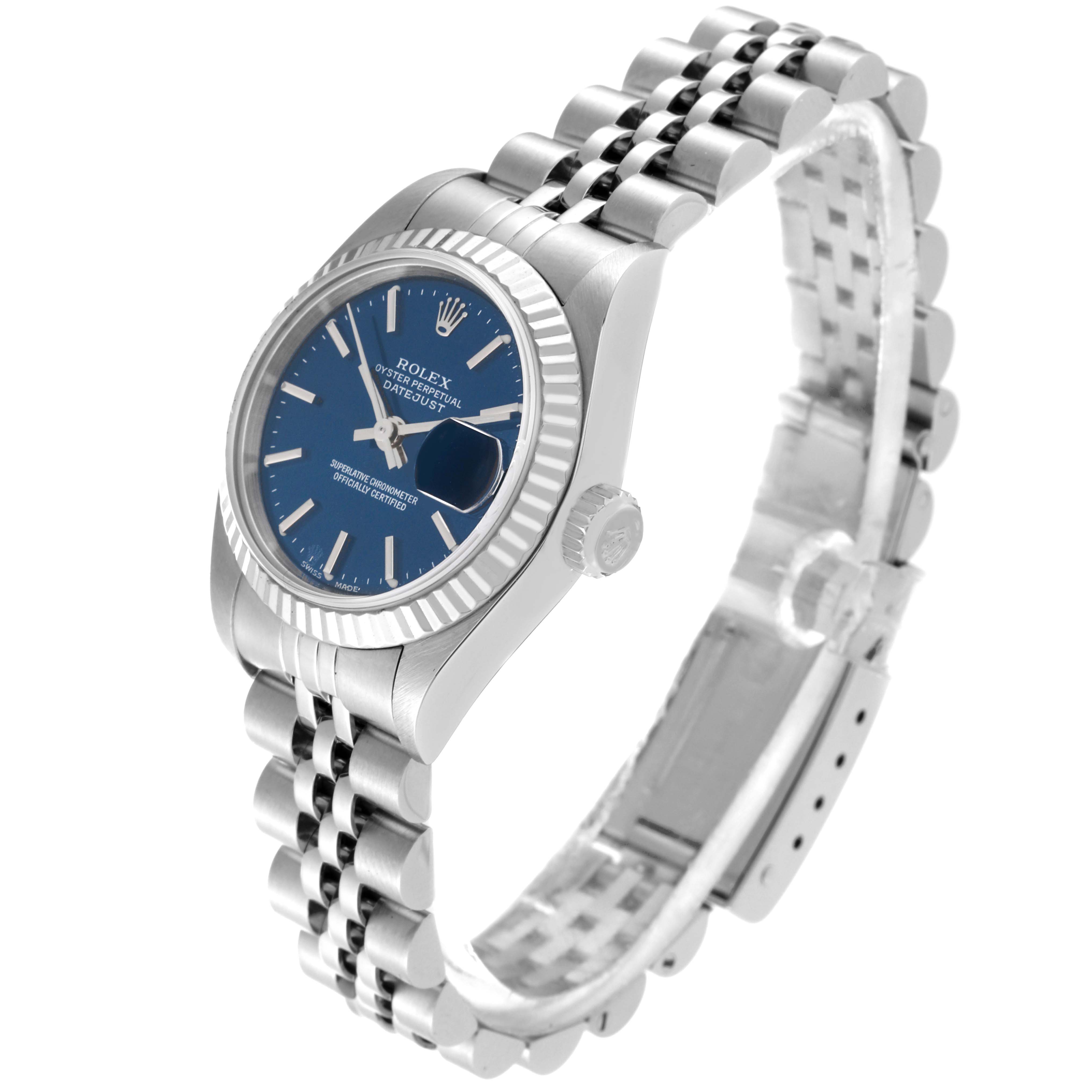 The image shows a Rolex Datejust 79174 Women's Stainless Steel Blue Dial 79174 Women's Stainless Steel Blue Dial watch at an angled side view, highlighting the blue dial, fluted bezel, and jubilee bracelet.