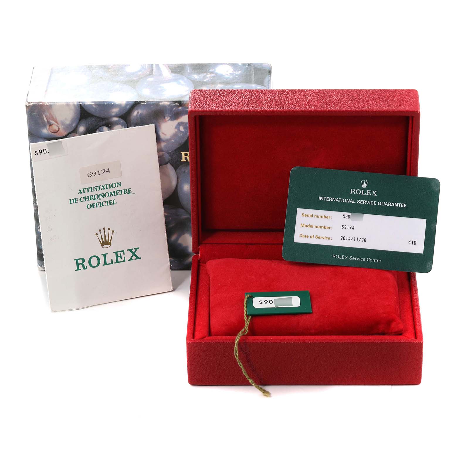 The image shows a Rolex Datejust 69174 Women's Stainless Steel White Dial 69174 Women's Stainless Steel White Dial's packaging box, international service guarantee card, official chronometer certification, and cushion.