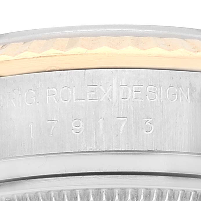The image shows a close-up of the case side on a Rolex Datejust 179173 Women's Steel and Gold (two tone) Champagne Dial 179173 Women's Steel and Gold (two tone) Champagne Dial, highlighting the model number and manufacturer's inscription.