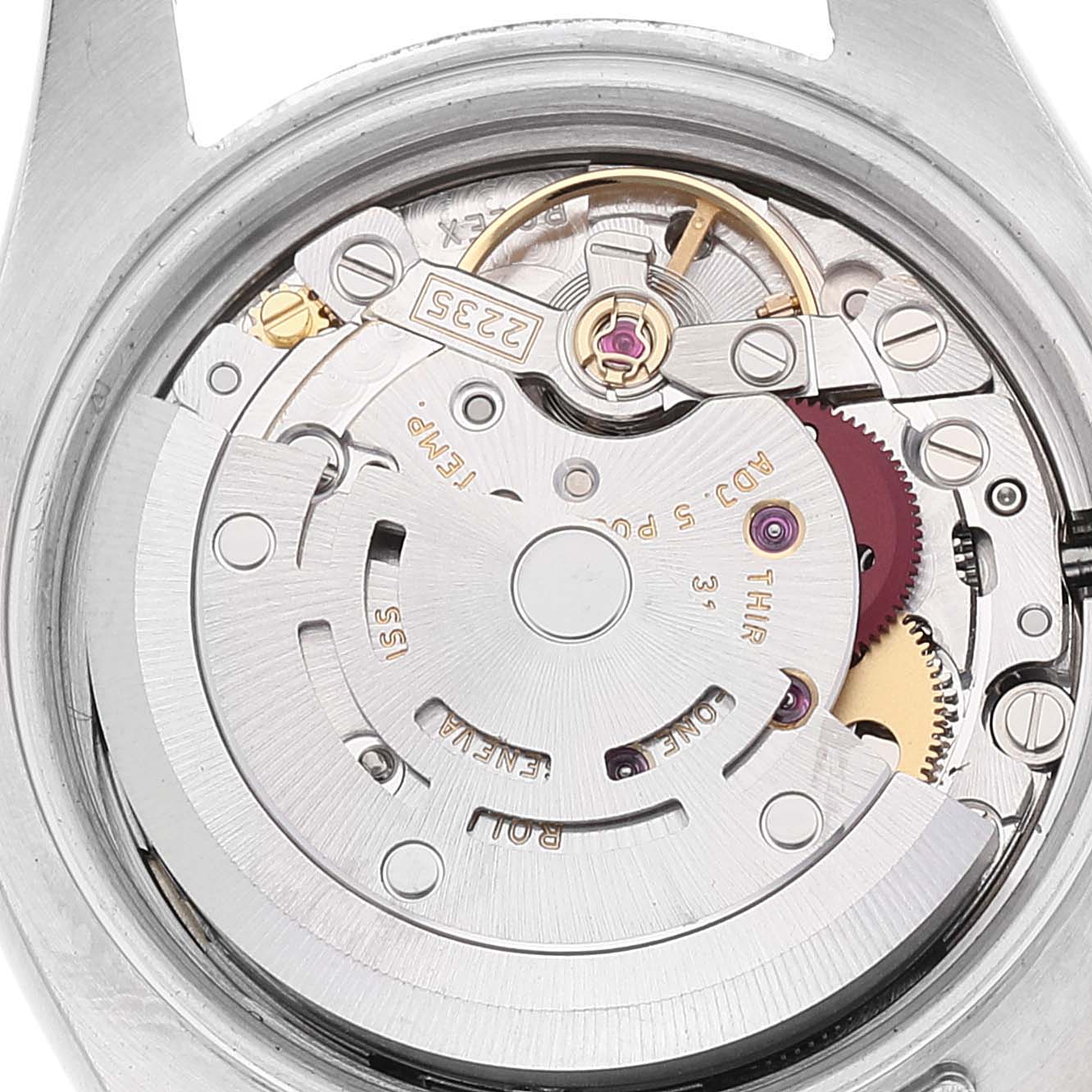 The image shows a close-up of the movement of a Rolex Datejust 179173 Women's Steel and Gold (two tone) Champagne Dial 179173 Women's Steel and Gold (two tone) Champagne Dial watch from a rear angle, focusing on the intricate internal components.