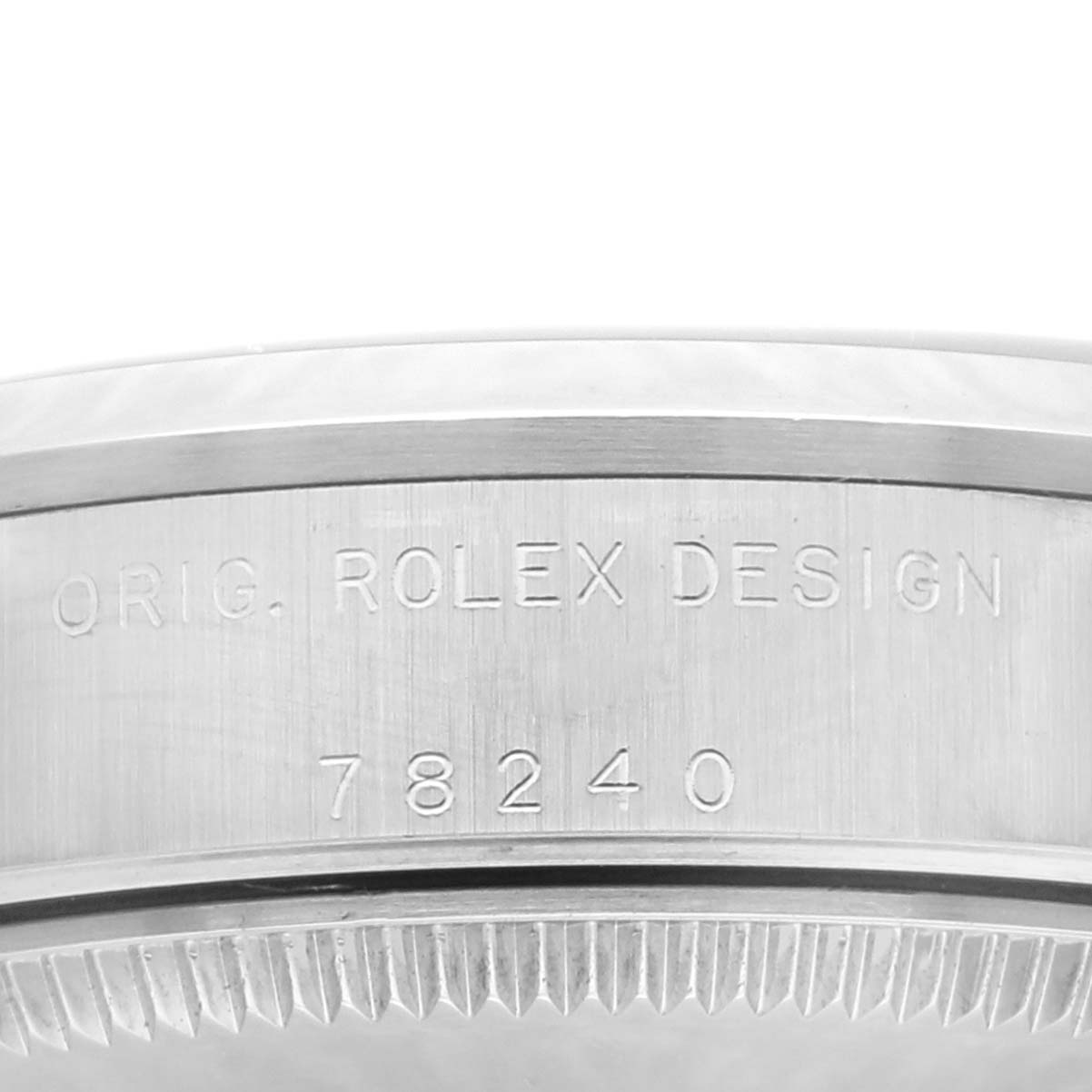 This close-up image shows the case side of the Rolex Mid-Size 78240 Women's Stainless Steel Pink Dial 78240 Women's Stainless Steel Pink Dial watch, displaying engraving details including the model number 78240.