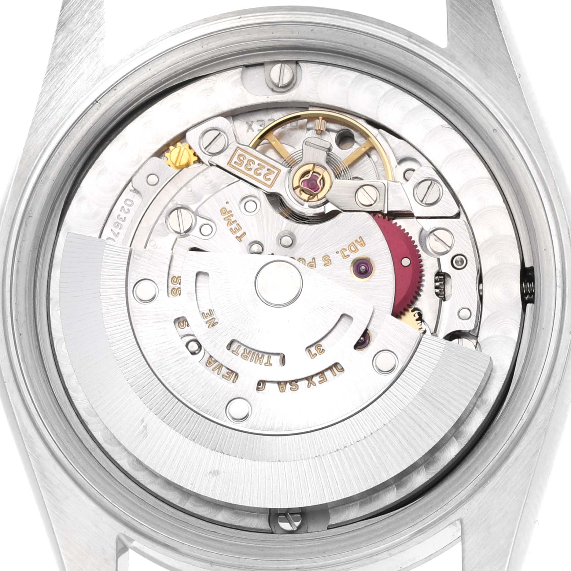The image shows a close-up view of the movement mechanism of a Mid-Size Rolex watch.