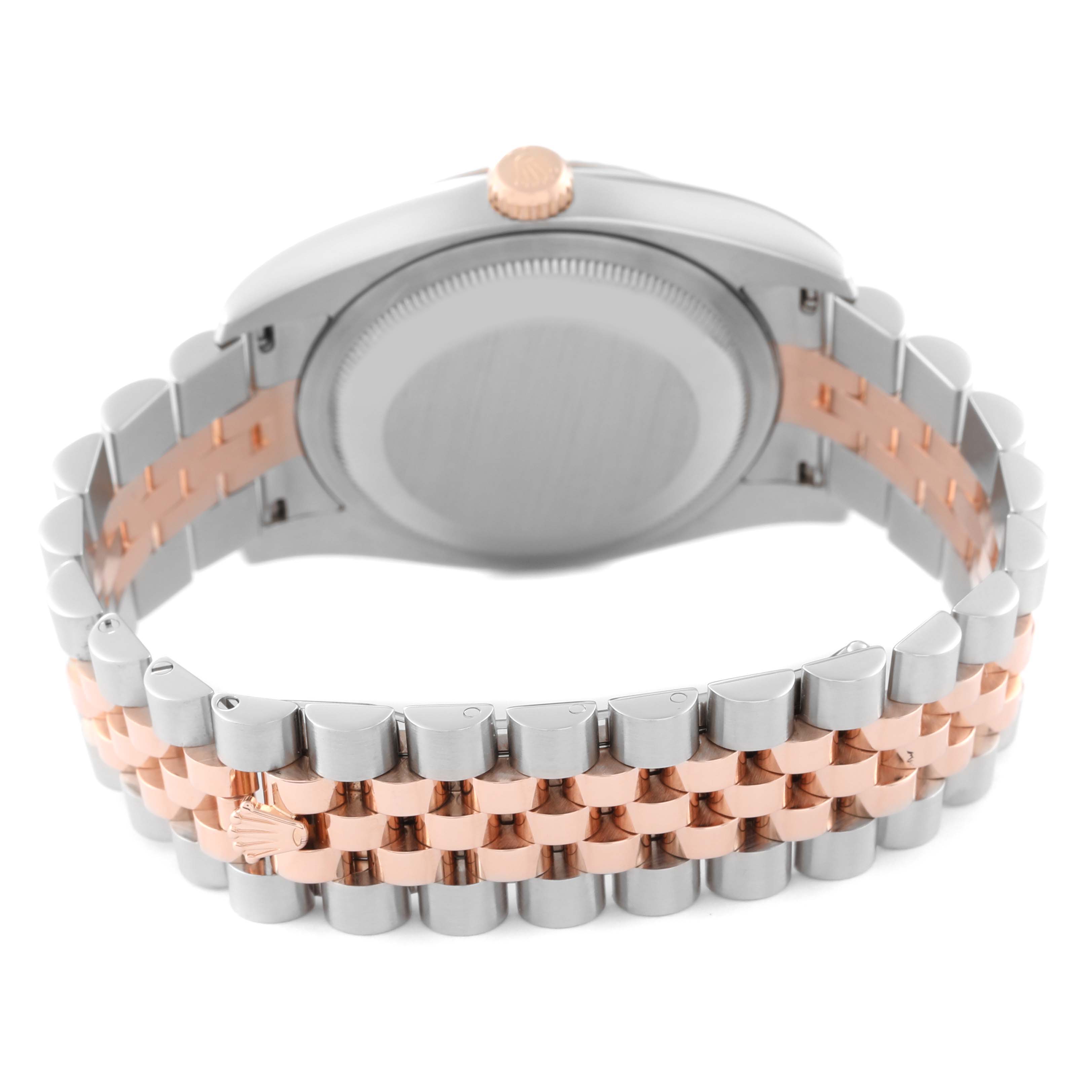 The image shows the back view of a Rolex Datejust 116231 Men's Steel and Gold (two tone) Silver Dial 116231 Men's Steel and Gold (two tone) Silver Dial, focusing on the case back, the watch's crown, and the two-tone bracelet.