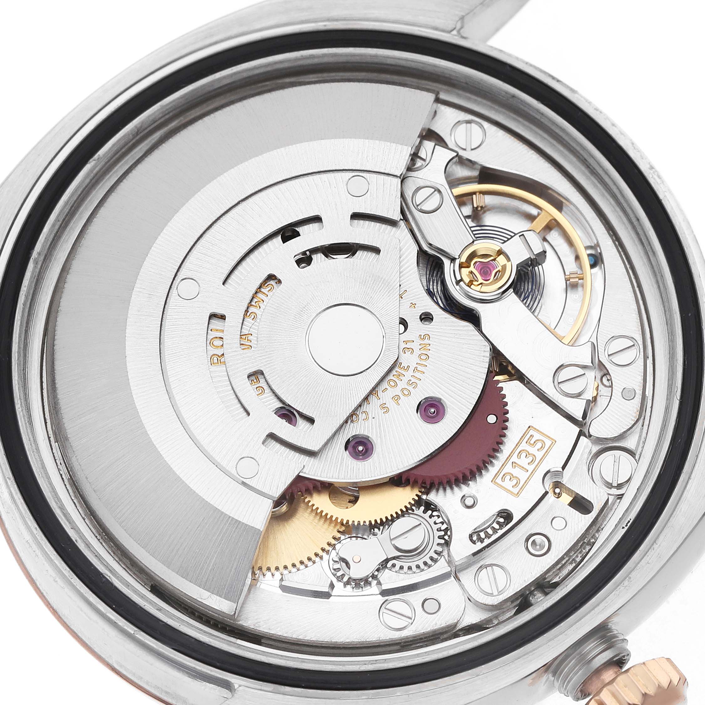 The image shows the intricate movement and internal mechanics of a Rolex Datejust 116231 Men's Steel and Gold (two tone) White Dial watch viewed from the back.