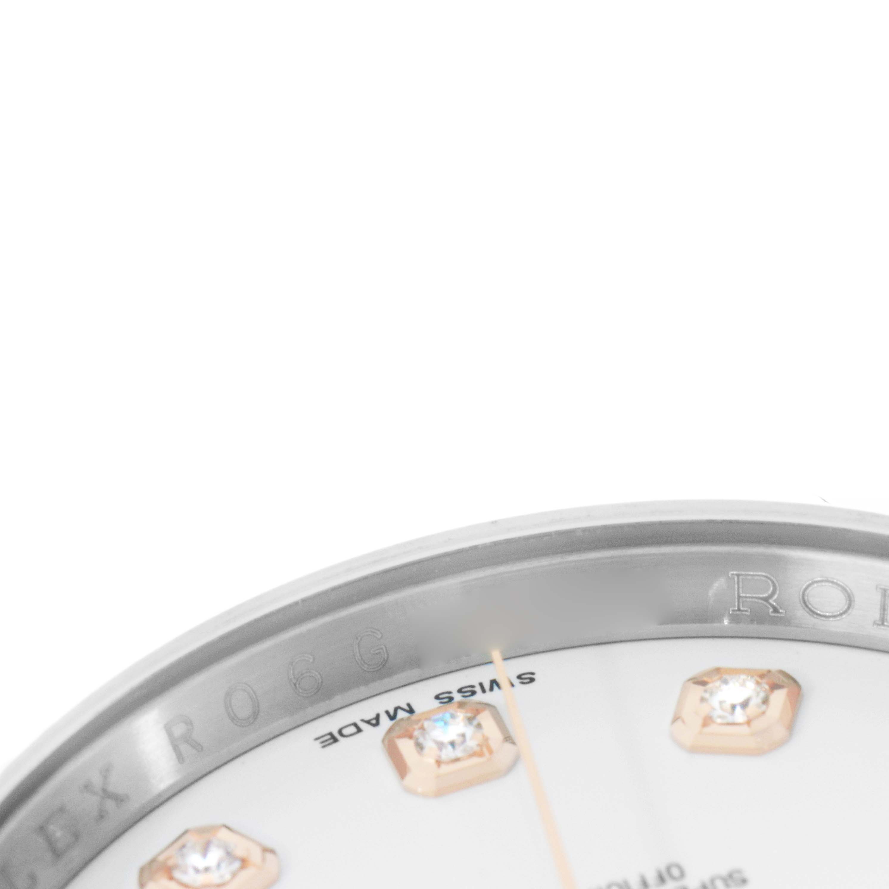The image shows a close-up of the dial and bezel edge of a Rolex Datejust 116231 Men's Steel and Gold (two tone) White Dial, highlighting diamond markers and engraved details.