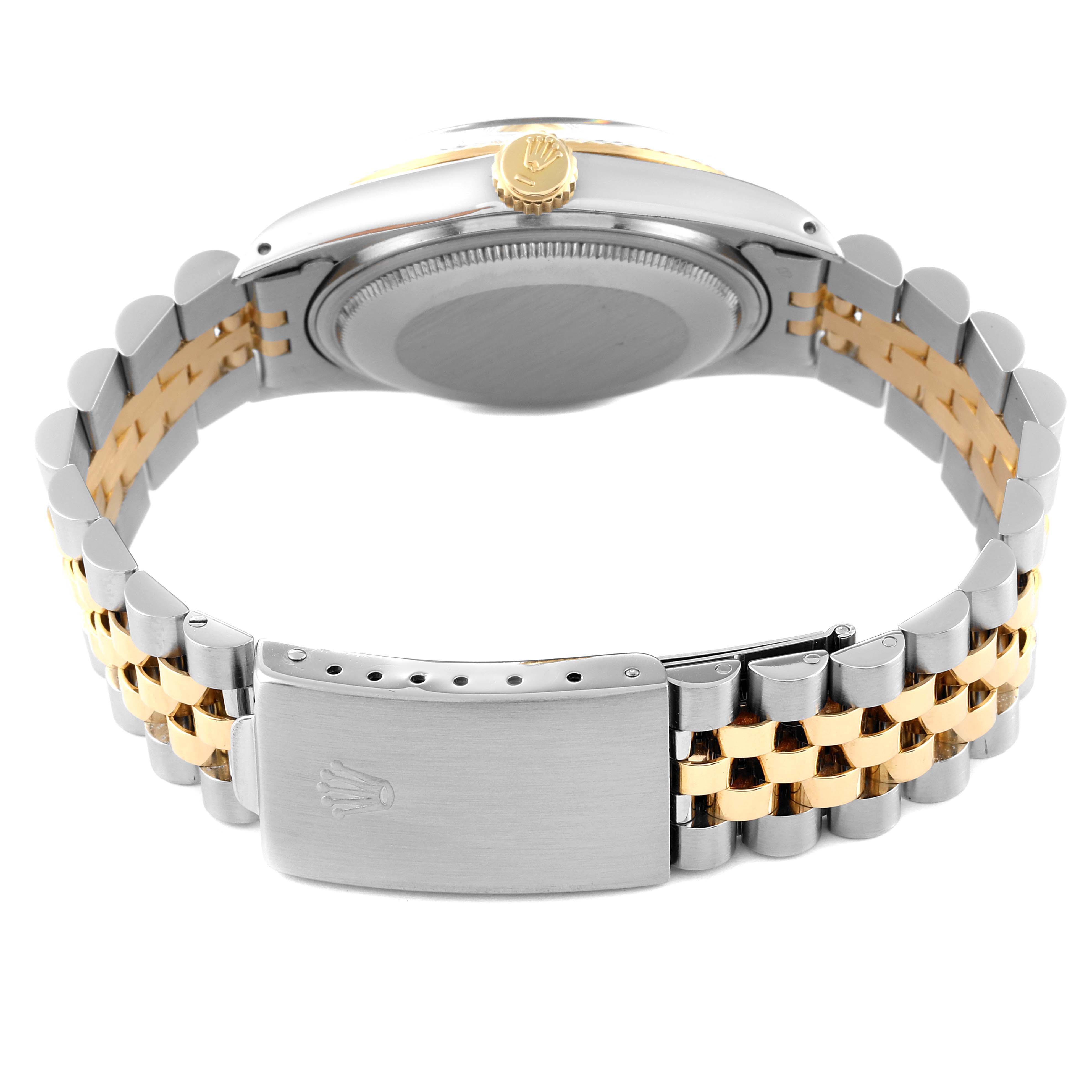 The image shows the back view of the Rolex Vintage Collection 16013 Men
s Steel and Gold (two tone) Champagne Dial 16013 Men
s Steel and Gold (two tone) Champagne Dial watch, focusing on its clasp, case back, and bracelet.