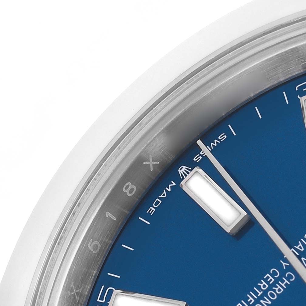 The image shows a close-up of the Rolex Datejust 41 126300 Men's Stainless Steel Blue Dial, highlighting part of the blue dial, hour markers, and the inner bezel.