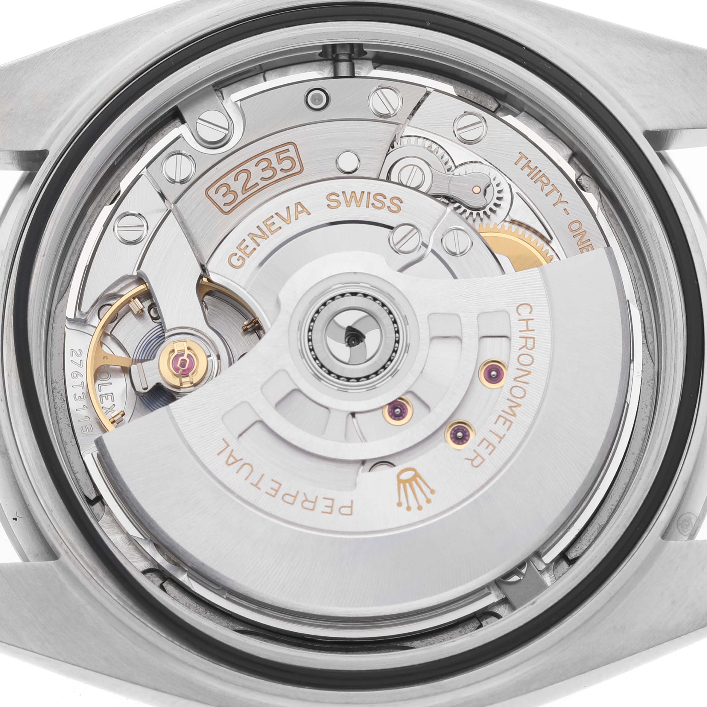 The image shows the movement of the Rolex Datejust 41 126300 Men's Stainless Steel Blue Dial from a rear angle, highlighting the intricate internal mechanics.