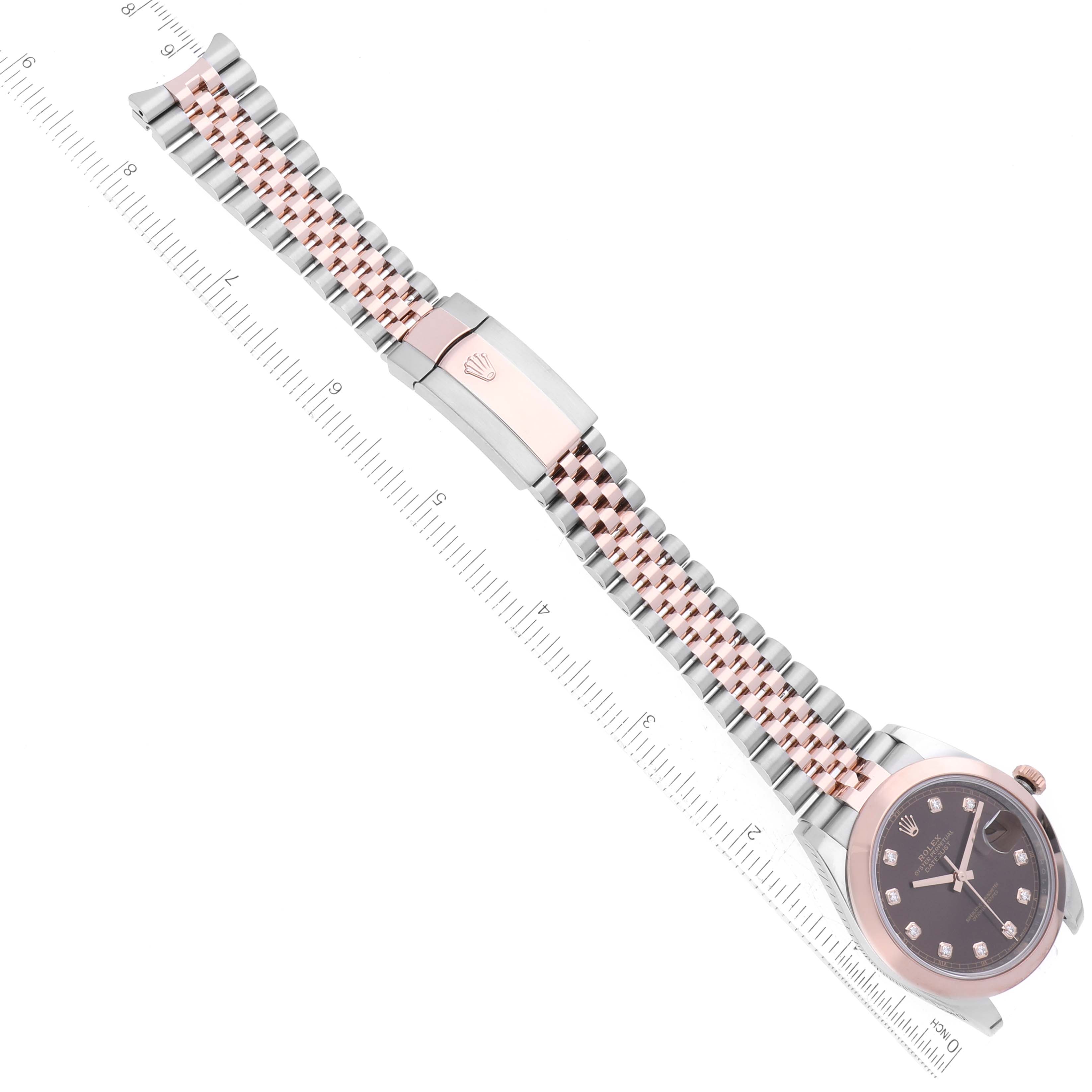 The image shows a Rolex Datejust 41 126301 Men
s Steel and Gold (two tone) Brown Dial 126301 Men
s Steel and Gold (two tone) Brown Dial watch and bracelet from an angled top-down view, featuring the dial and bracelet with the clasp.