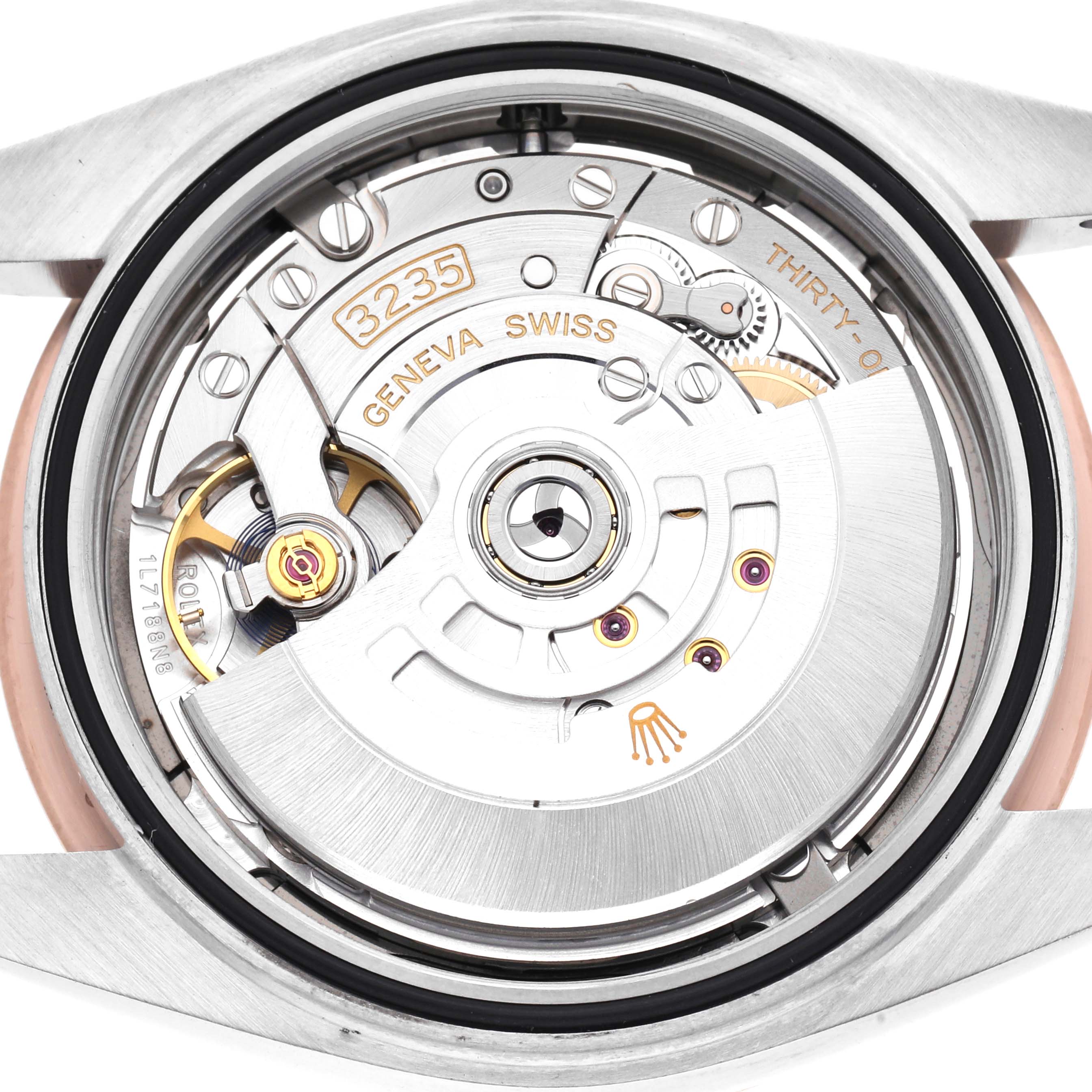 The image shows the movement of a Rolex Datejust 41 126301 Men's Steel and Gold (two tone) Grey Dial watch from the back, featuring the intricate components and engravings.