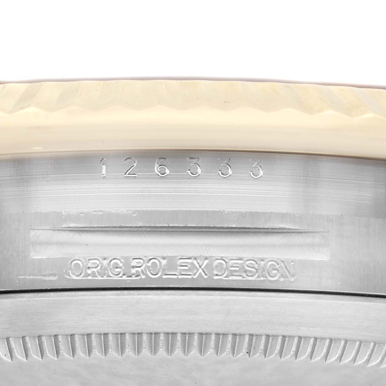 This is a close-up of the serial and model number area on a Rolex Datejust 41 126333 Men's Steel and Gold (two tone) Champagne Dial 126333 Men's Steel and Gold (two tone) Champagne Dial, showing "ORG. ROLEX DESIGN" engraving.