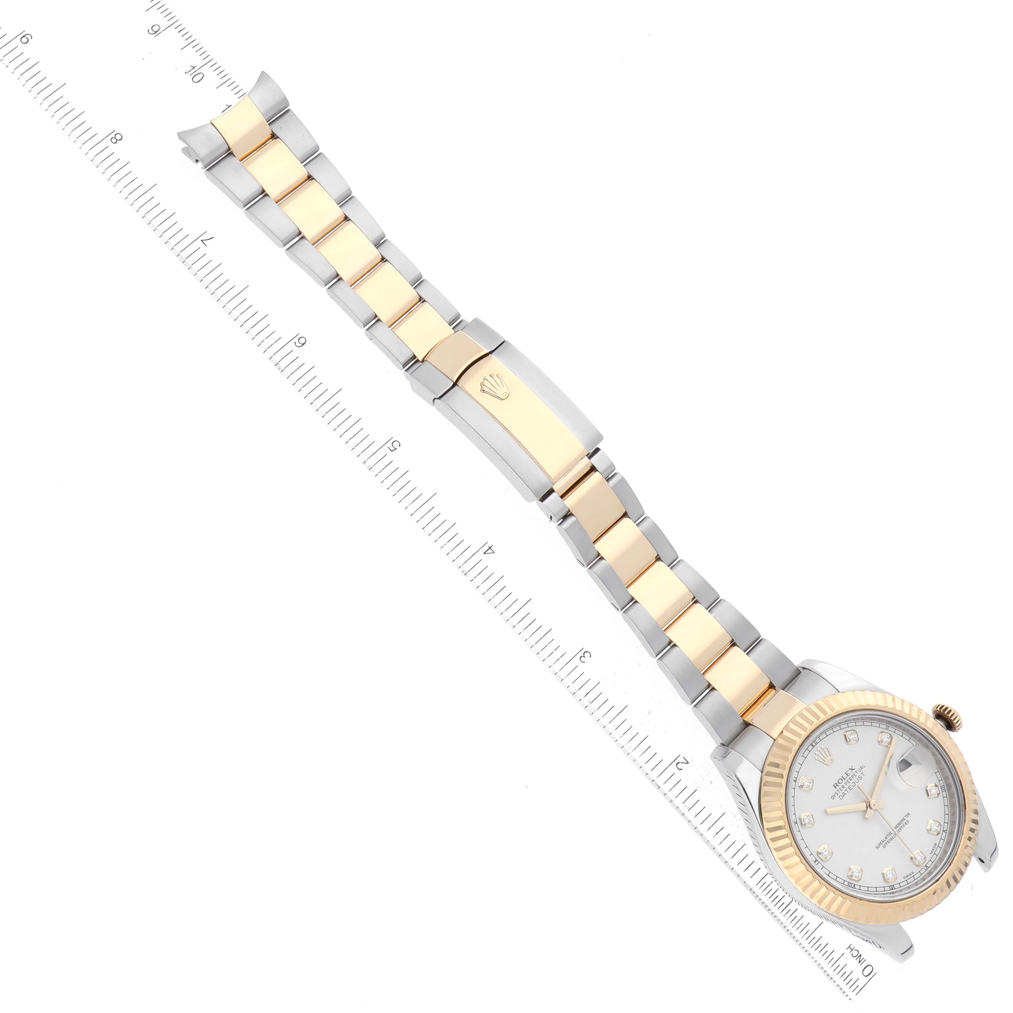 The image shows a Rolex Datejust 41 116333 Men's Steel and Gold (two tone) Silver Dial 116333 Men's Steel and Gold (two tone) Silver Dial watch laid flat, highlighting its gold and silver bracelet with a ruler for scale.