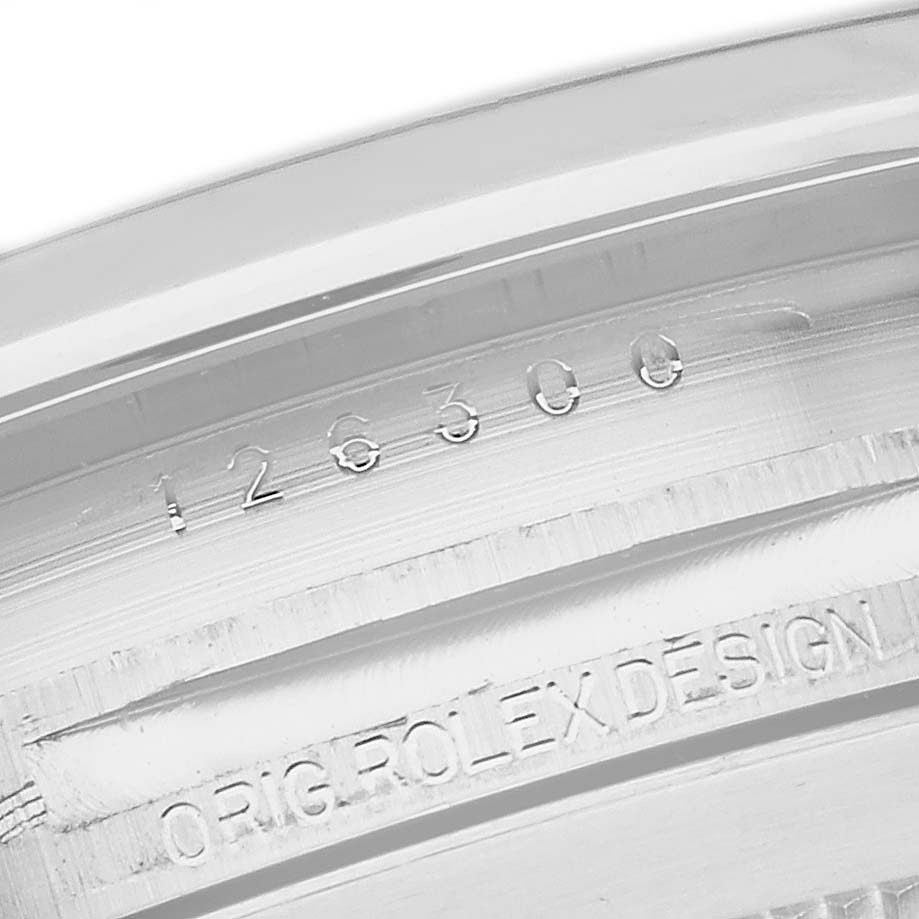 This image shows a close-up of the inner bezel and serial number of a Rolex Datejust 41 126300 Men's Stainless Steel White Dial 126300 Men's Stainless Steel White Dial watch.