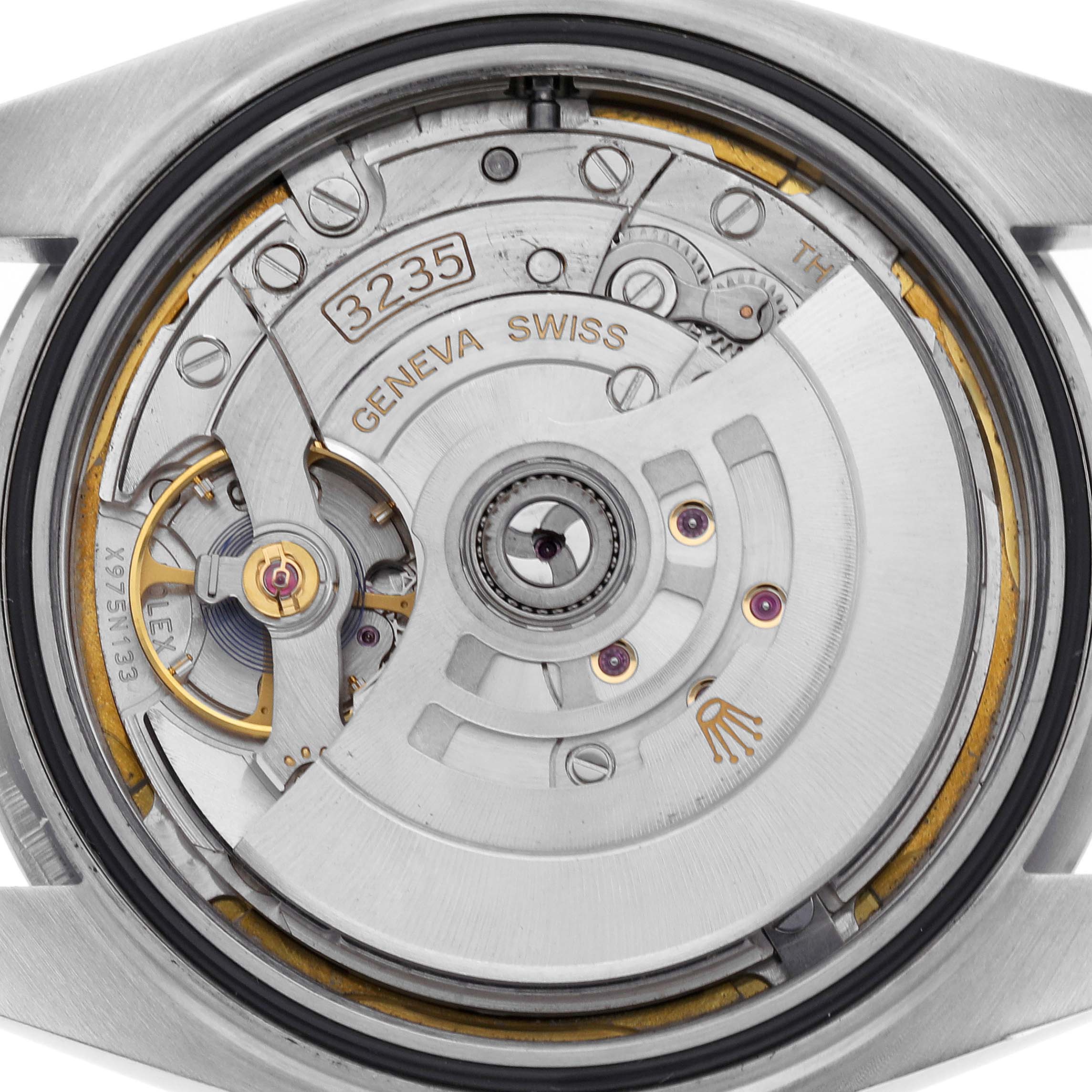 The image displays the intricate movement and rotor of a Rolex Datejust 41 126300 Men's Stainless Steel White Dial 126300 Men's Stainless Steel White Dial watch from a rear angle.