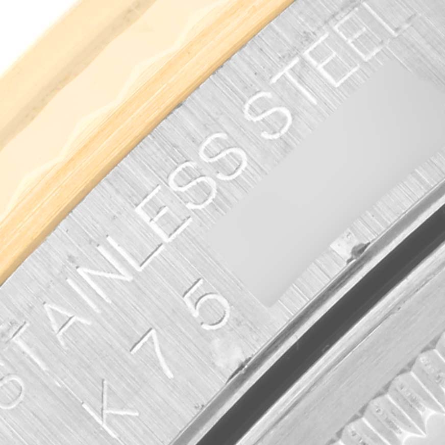 Close-up of the inner bezel and case of a Rolex Datejust 16233 Men's Steel and Gold (two tone) Blue Dial 16233 Men's Steel and Gold (two tone) Blue Dial watch, showing the "STAINLESS STEEL" engraving.