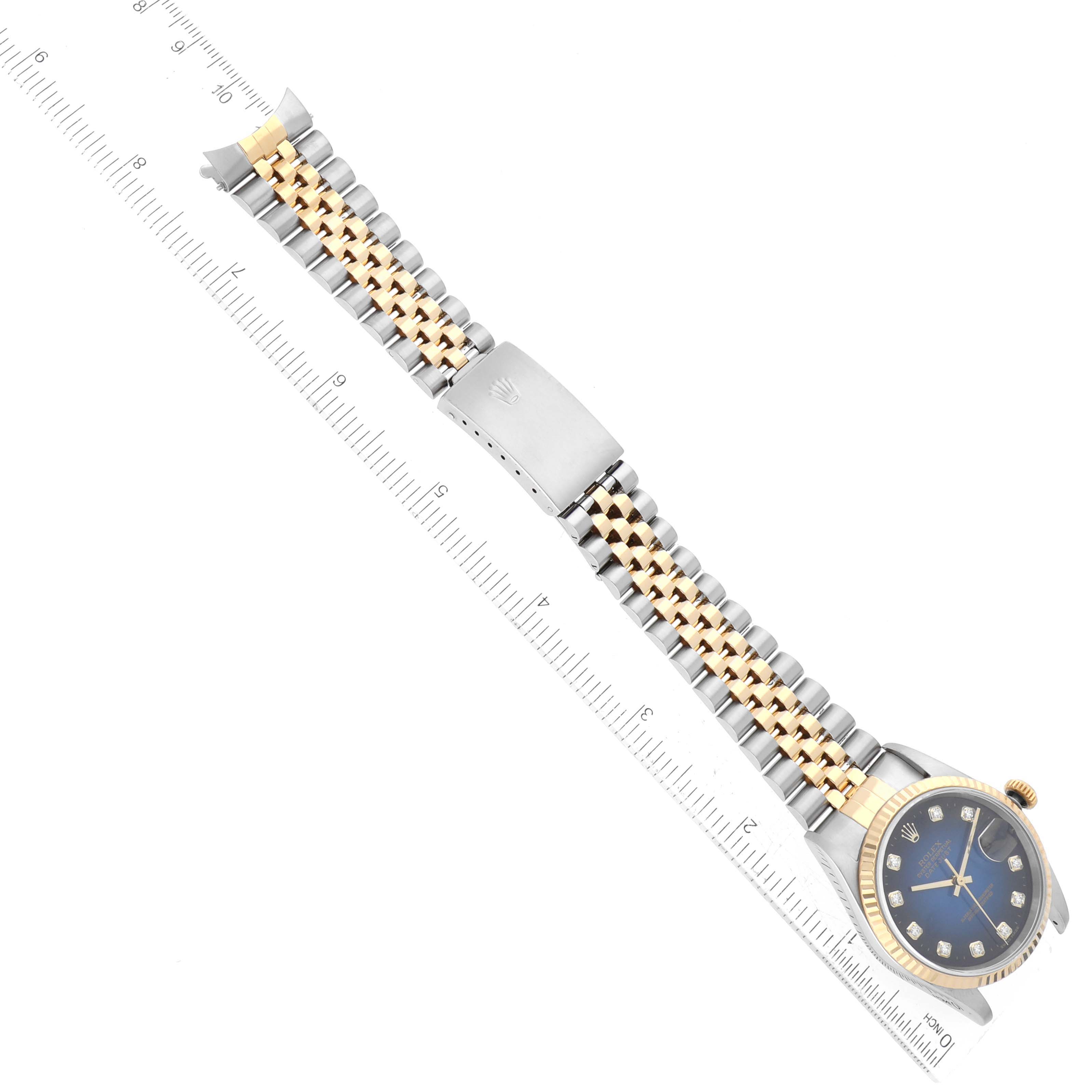The image shows a top-down view of a Rolex Datejust 16233 Men's Steel and Gold (two tone) Blue Dial 16233 Men's Steel and Gold (two tone) Blue Dial watch, displaying the full bracelet and blue dial.