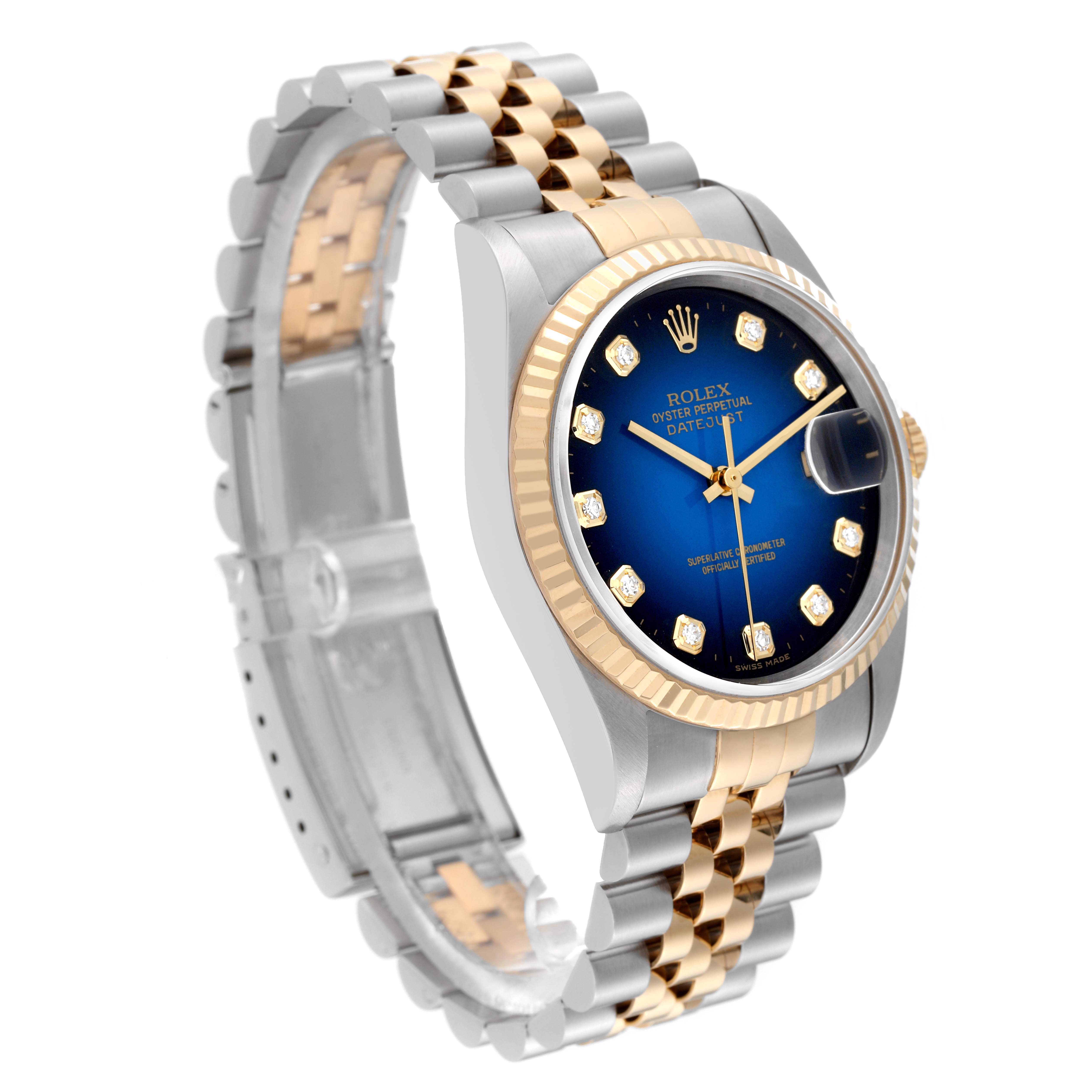 The image shows a Rolex Datejust 16233 Men's Steel and Gold (two tone) Blue Dial 16233 Men's Steel and Gold (two tone) Blue Dial watch angled to display the dial, fluted bezel, and two-tone bracelet.