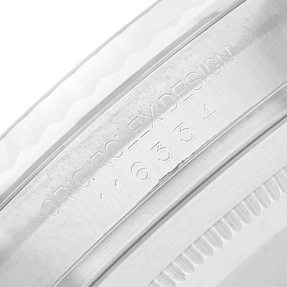 The image shows a close-up of the engraved bezel edge of a Rolex Datejust 41 116334 Men
s Stainless Steel Silver Dial, highlighting the model details.