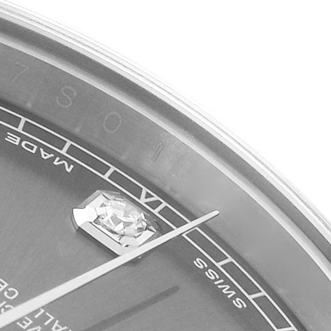 The image shows a close-up of the Rolex Datejust 41 116334 Men
s Stainless Steel Silver Dial
s dial, highlighting a diamond marker and part of the seconds hand.