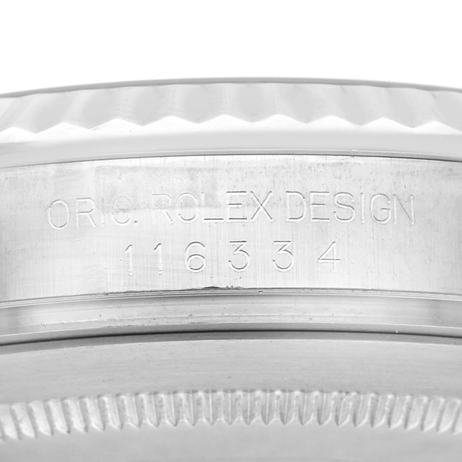 Side view of the Rolex Datejust 41 116334 Men
s Stainless Steel Silver Dial 116334 Men
s Stainless Steel Silver Dial model showing the engraved case with the design number.