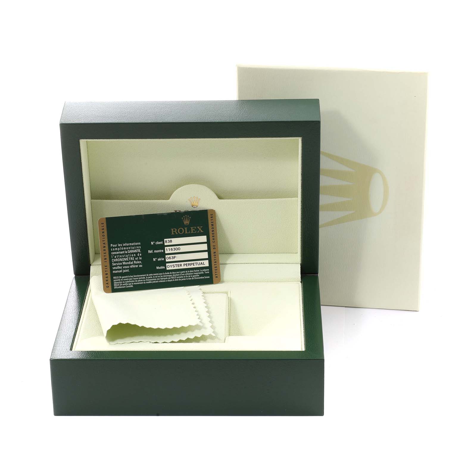 The image shows a green box for the Rolex Datejust 41 116300 Men's Stainless Steel Blue Dial 116300 Men's Stainless Steel Blue Dial model, containing a warranty card and a cleaning cloth.