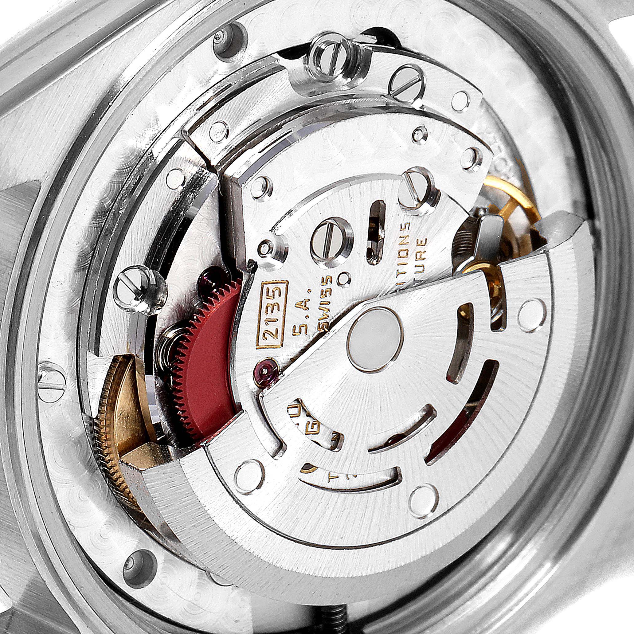 The image shows a close-up view of the mechanical movement of a Rolex Mid-Size 68273 Women
s Steel and Gold (two tone) Champagne Dial 68273 Women
s Steel and Gold (two tone) Champagne Dial model watch.