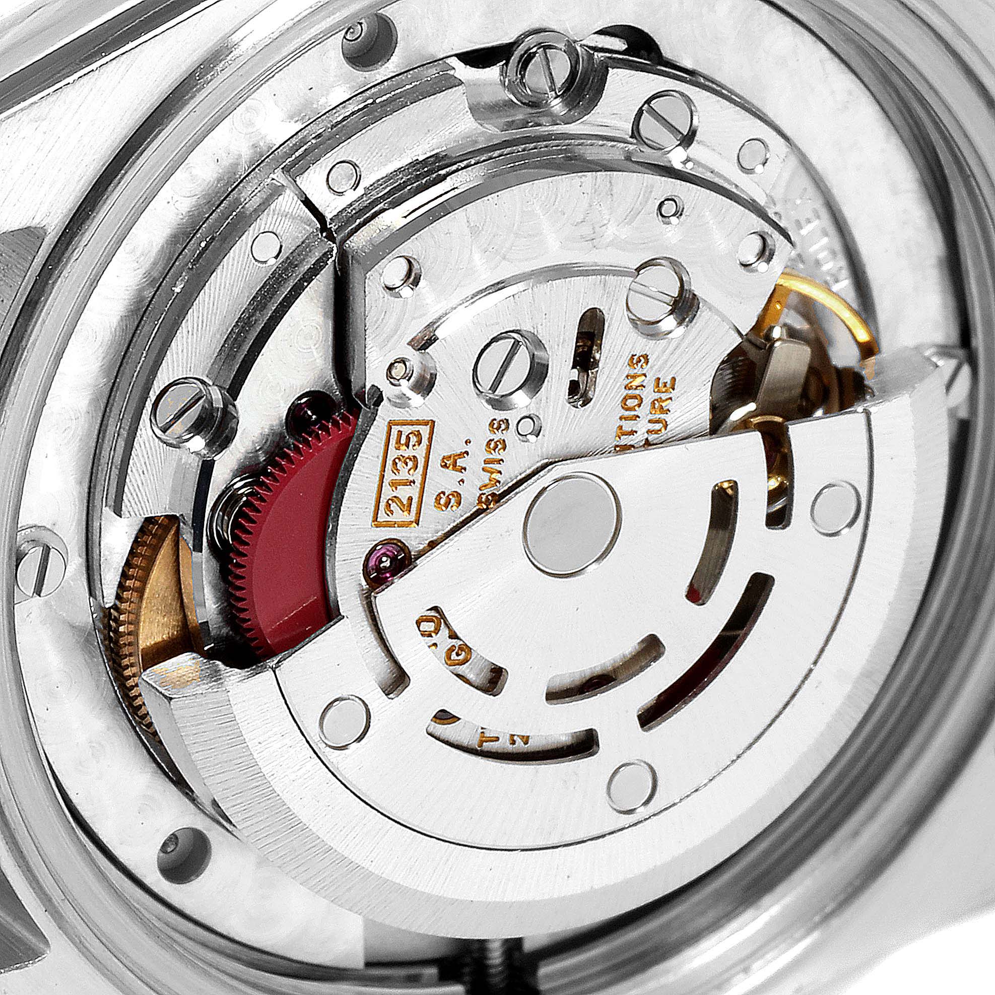 This image shows the internal mechanical movement of a Rolex Mid-Size 68273 Women
s Steel and Gold (two tone) Champagne Dial 68273 Women
s Steel and Gold (two tone) Champagne Dial watch from a close-up angle.