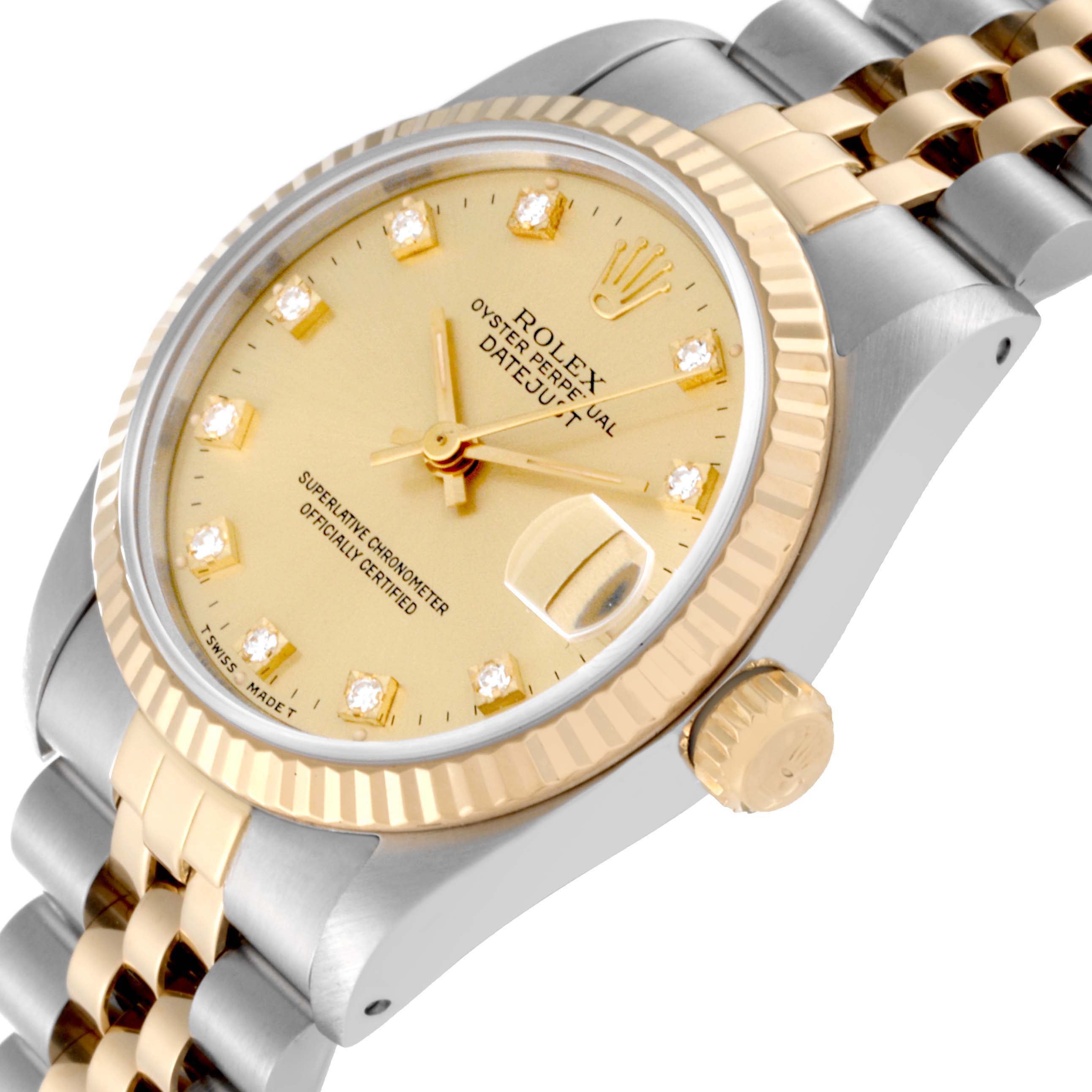 The image shows a close-up of a Rolex Mid-Size 68273 Women's Steel and Gold (two tone) Champagne Dial 68273 Women's Steel and Gold (two tone) Champagne Dial Datejust watch's face, bezel, and part of the two-tone bracelet from an angled perspective.