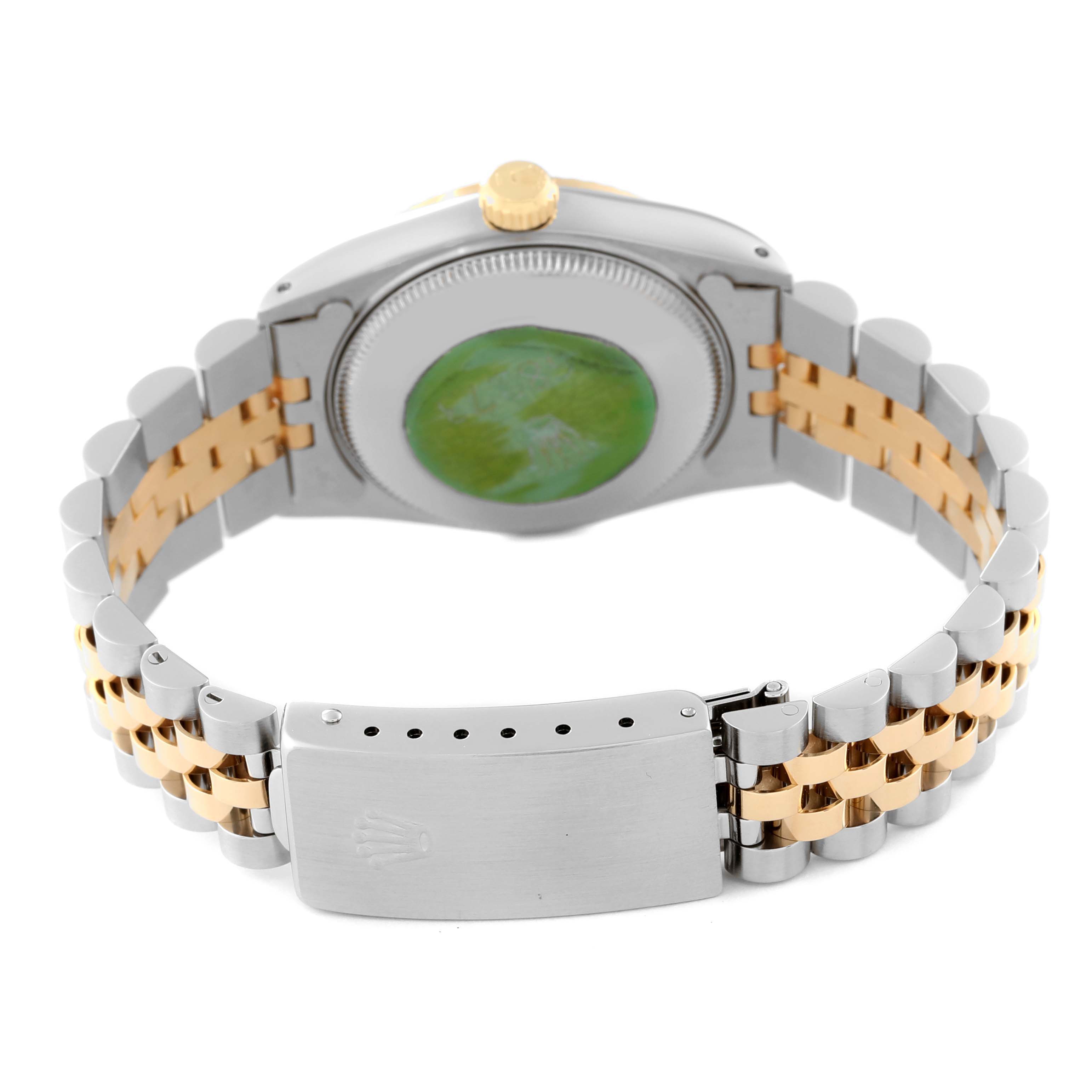The image shows the back view of a Mid-Size Rolex watch, focusing on the case back, crown, and two-tone bracelet with clasp.