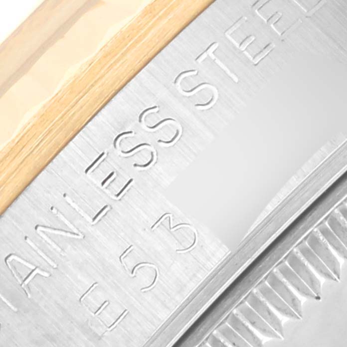 This image shows a close-up of the side of a mid-size Rolex watch, highlighting the stainless steel and part of the bezel.