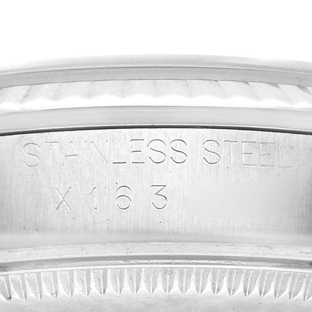 This close-up image shows the stainless steel casing of a Mid-Size Rolex watch, focusing on the engraved model number.