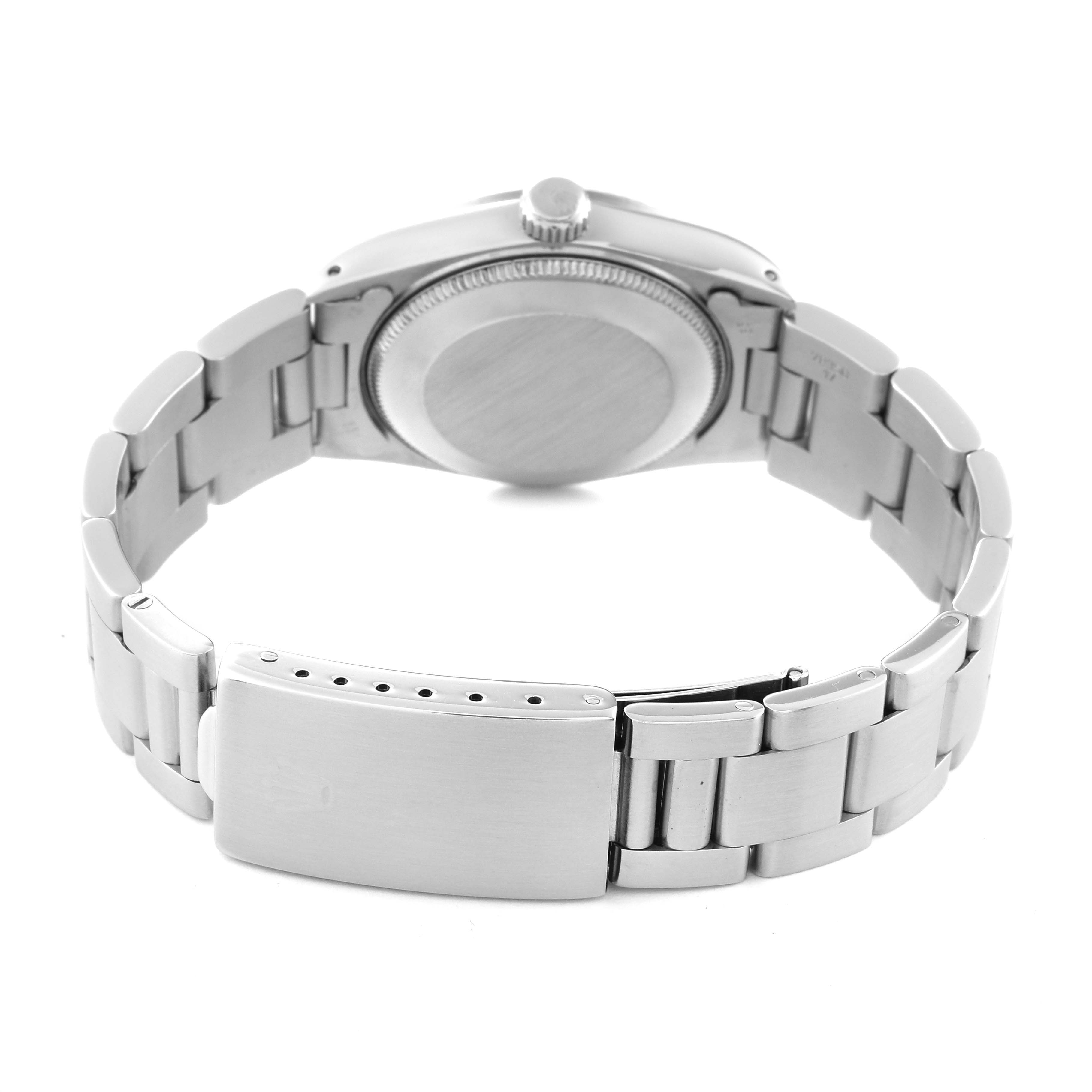 This image shows the back view of a Rolex Mid-Size 68274 Women's Stainless Steel Blue Dial 68274 Women's Stainless Steel Blue Dial watch, highlighting the case back and part of the stainless steel bracelet and clasp.