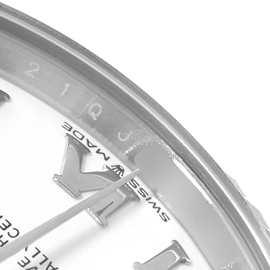 This image shows a close-up angle of the dial, bezel, and hour markers of a Rolex Mid-Size 278274 Women's Stainless Steel White Dial 278274 Women's Stainless Steel White Dial model watch.