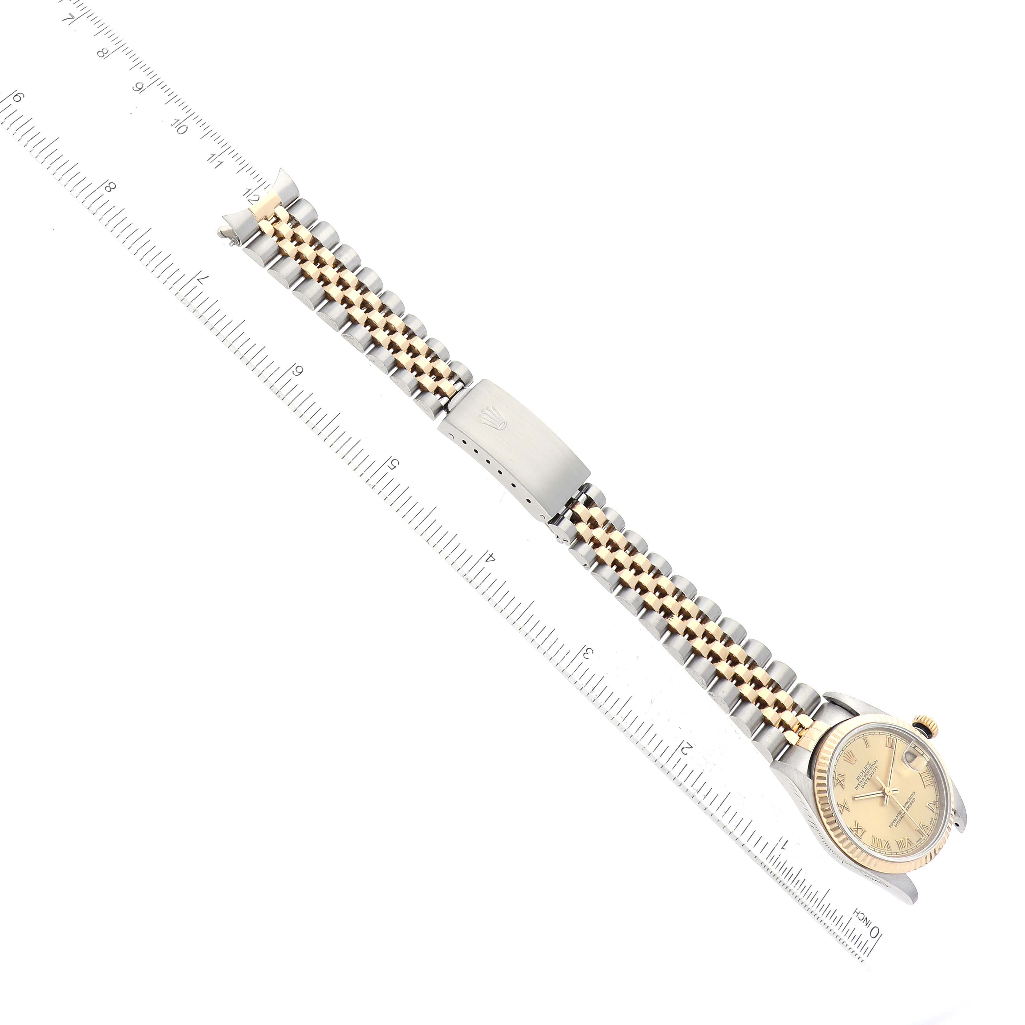 The image shows the full length of the Rolex Mid-Size 78273 Women's Steel and Gold (two tone) Champagne Dial 78273 Women's Steel and Gold (two tone) Champagne Dial watch, including the face, bezel, bracelet, and clasp, placed alongside a ruler.