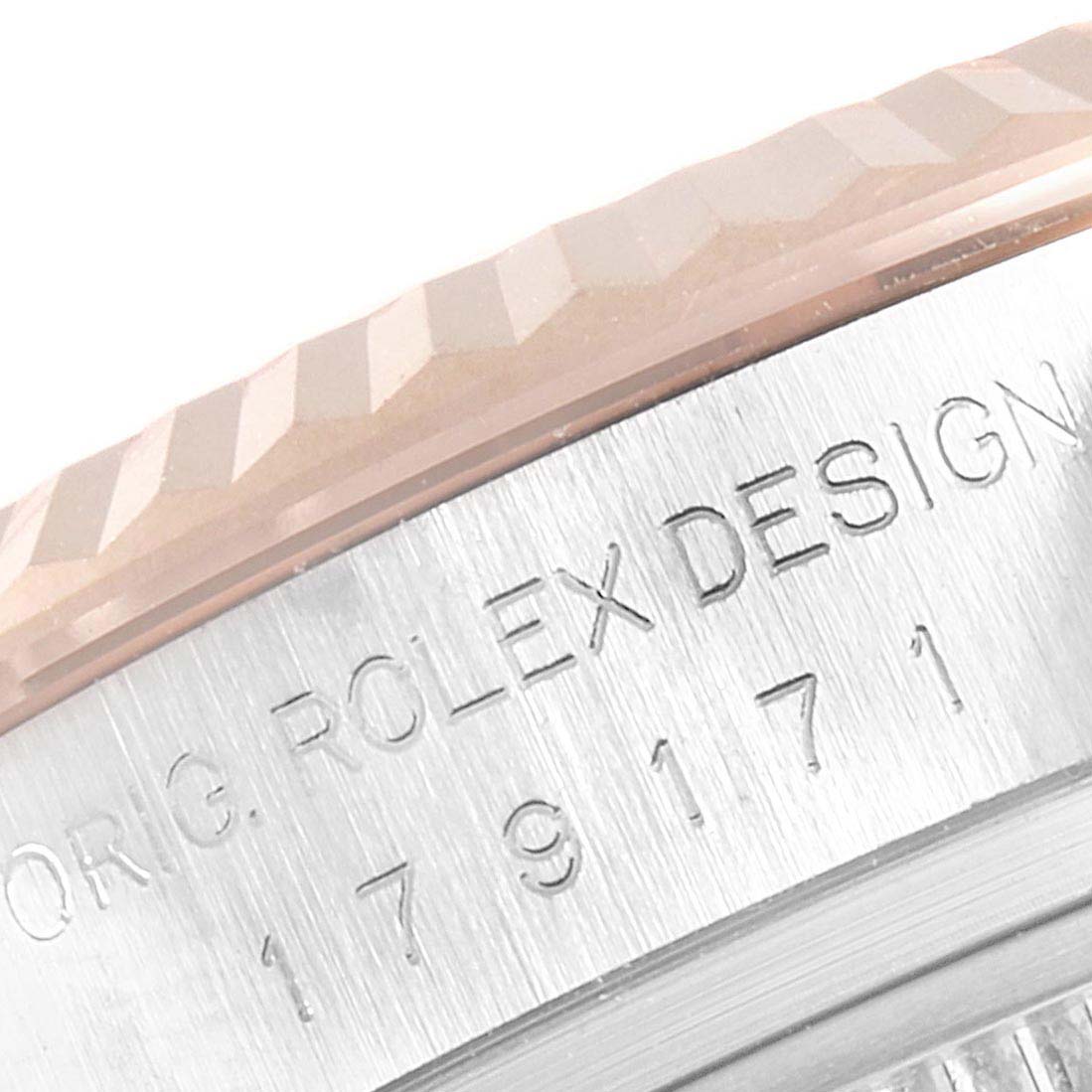 This image shows a close-up of the bezel and case side of a Rolex Datejust 179171 Women's Steel and Gold (two tone) White Dial 179171 Women's Steel and Gold (two tone) White Dial watch.