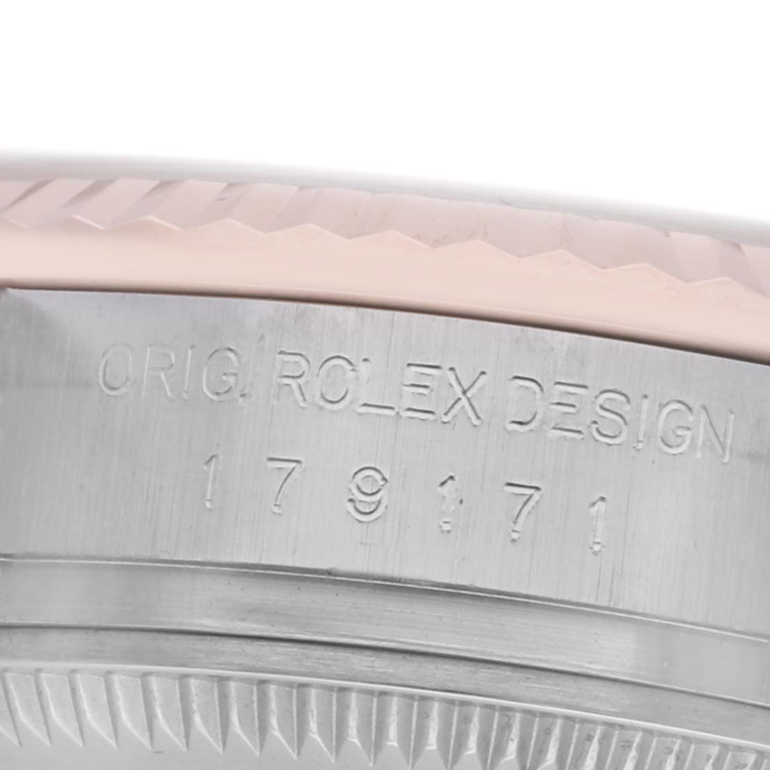 The image shows a close-up of the side of a Rolex Datejust 179171 Women's Steel and Gold (two tone) Black Dial, highlighting the engraved design reference and bezel details.