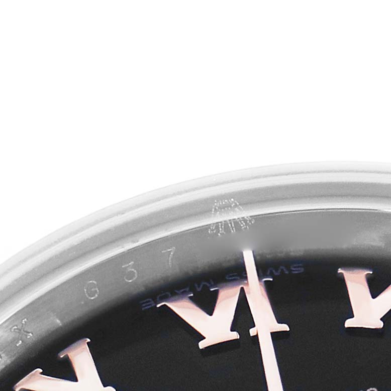 The image shows a close-up of the dial and bezel of a Rolex Datejust 179171 Women's Steel and Gold (two tone) Black Dial, highlighting the Roman numeral hour markers.