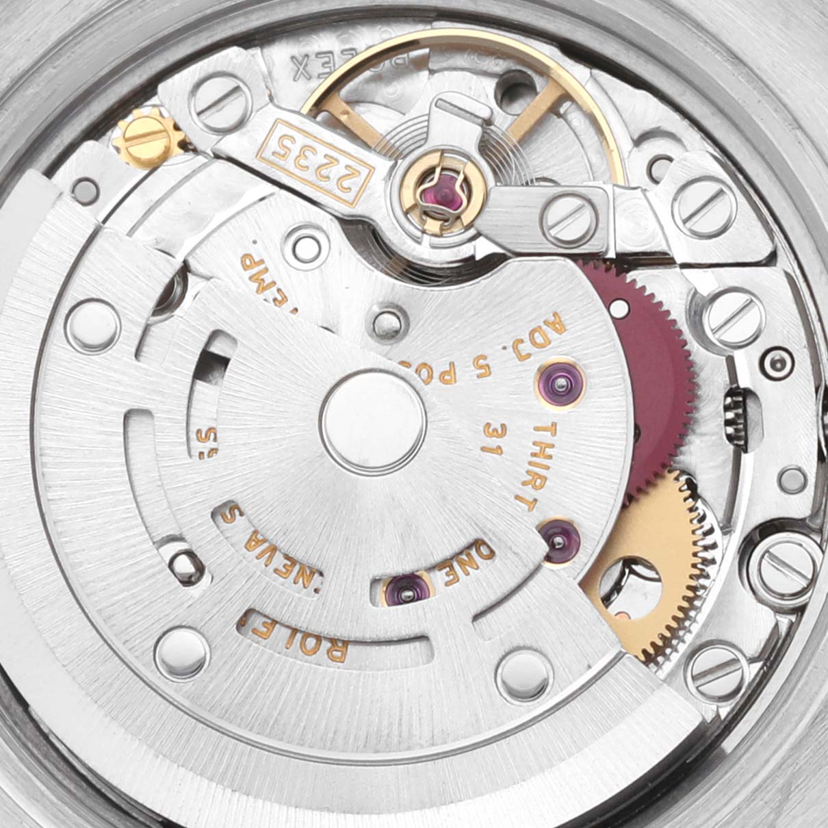This image shows a close-up view of the intricate internal mechanism of a Rolex Datejust 179171 Women's Steel and Gold (two tone) Pink Dial 179171 Women's Steel and Gold (two tone) Pink Dial watch, highlighting its movement components.