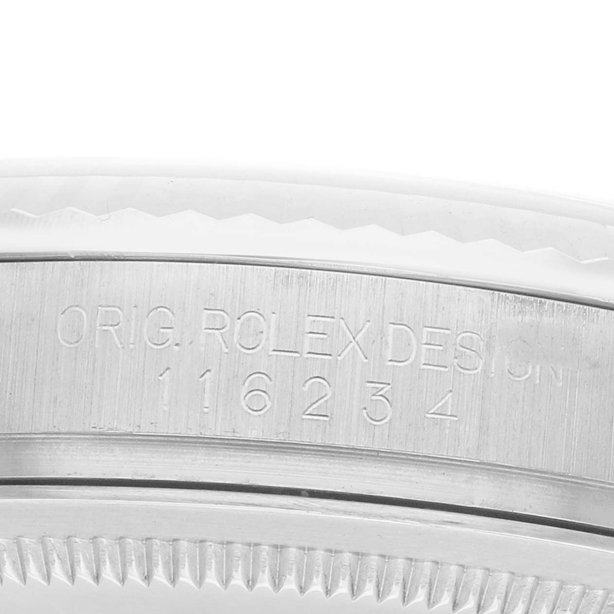 The image shows a close-up of the side engraving on the bezel of the Rolex Datejust 116234 Men
s Stainless Steel Silver Dial watch.