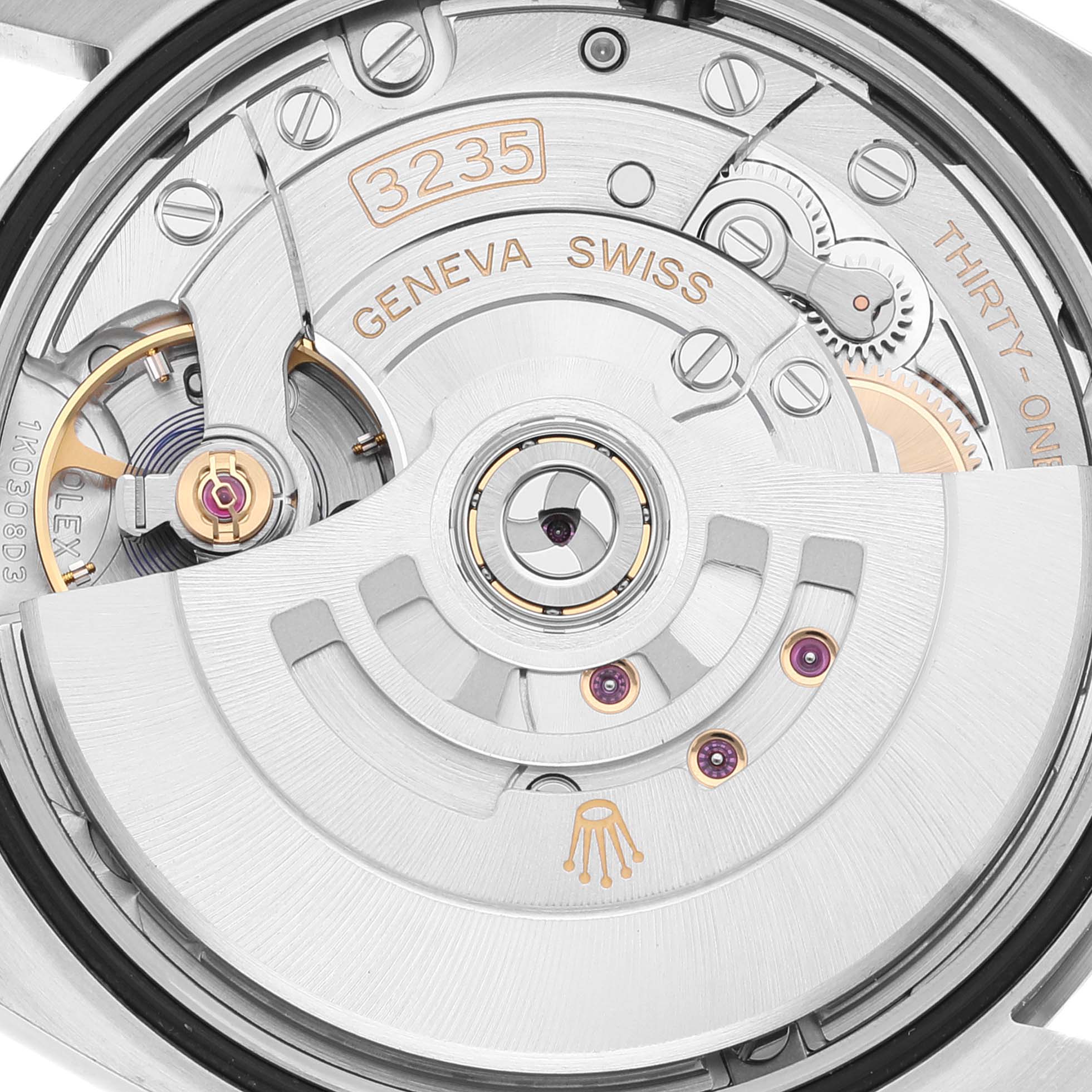 The image shows the movement mechanism of a Rolex Datejust 126234 Men's Stainless Steel Pink Dial 126234 Men's Stainless Steel Pink Dial watch, viewed from the back, highlighting the intricate parts and engravings.