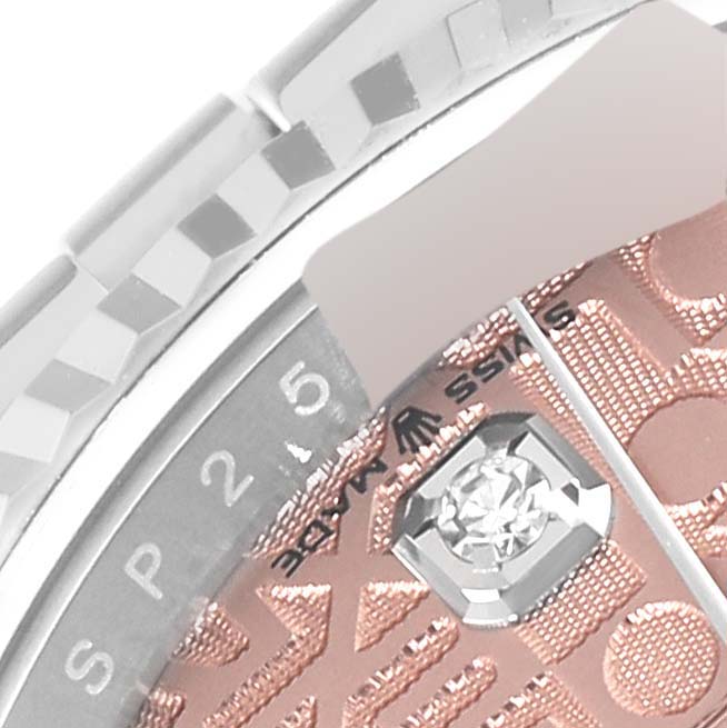 The image shows a close-up of the Rolex Datejust 126234 Men's Stainless Steel Pink Dial 126234 Men's Stainless Steel Pink Dial model, focusing on the textured dial and part of the bracelet.