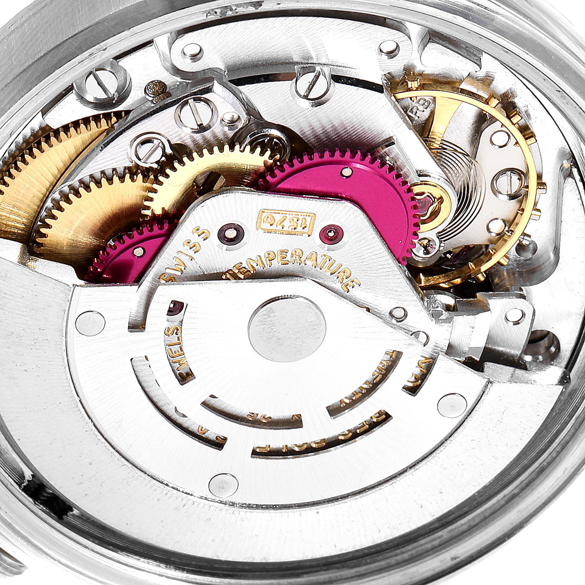 The image shows a close-up view of the internal mechanical movement of a Vintage Collection Rolex watch.