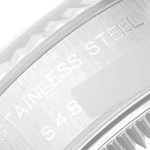 This image shows a close-up view of the text engraving on the side of the stainless steel case of a Rolex Datejust 69174 Women's Stainless Steel White Dial 69174 Women's Stainless Steel White Dial watch.