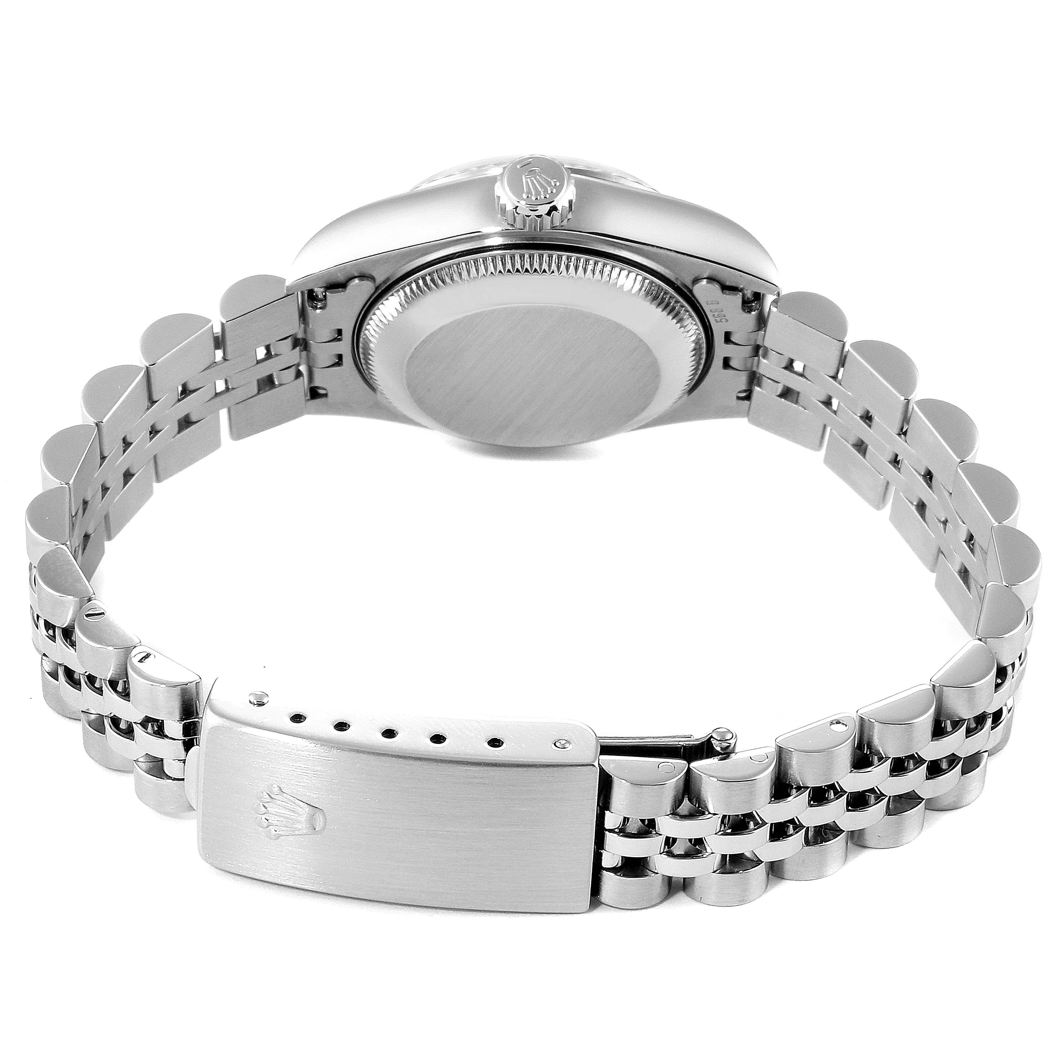 The image shows the case back, crown, and bracelet with clasp of a Rolex Datejust 69174 Women
s Stainless Steel White Dial 69174 Women
s Stainless Steel White Dial watch from a rear angle.